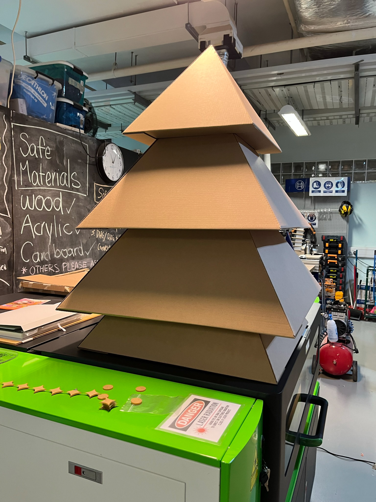 Prototyping a Christmas tree structure using cardboard and laser cutting.
