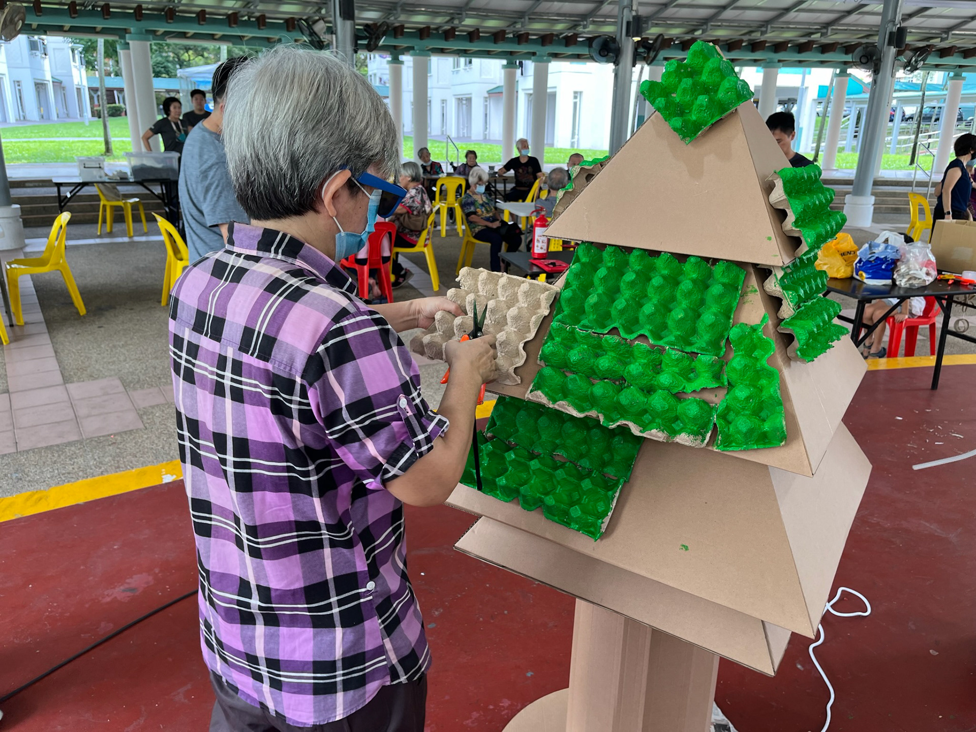 The egg cartons are then placed onto the structure.