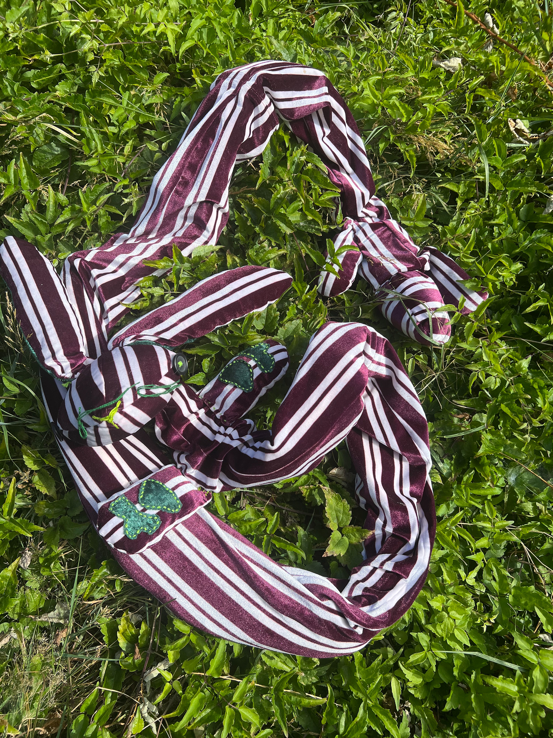 10 ft long striped bunny worm with hand-sewn details and soft internal skeleton