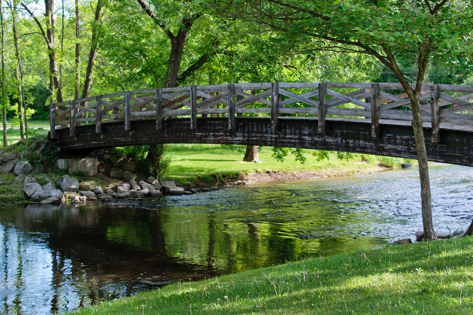 A bridge across Cedar River in Covered Bridge Park, Cedarburg, Wisconsin.