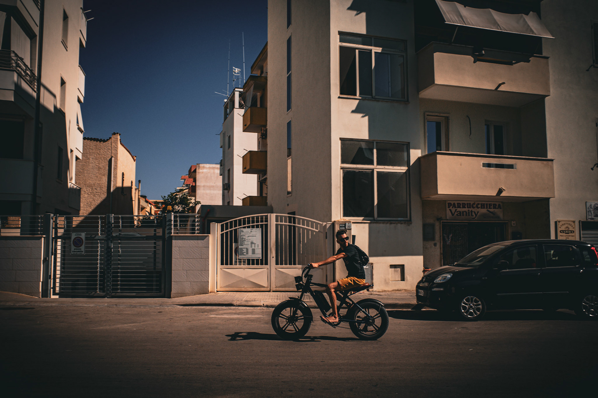 Riding through sunlit streets