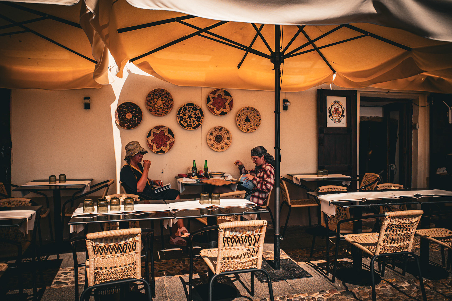 Conversations beneath woven suns