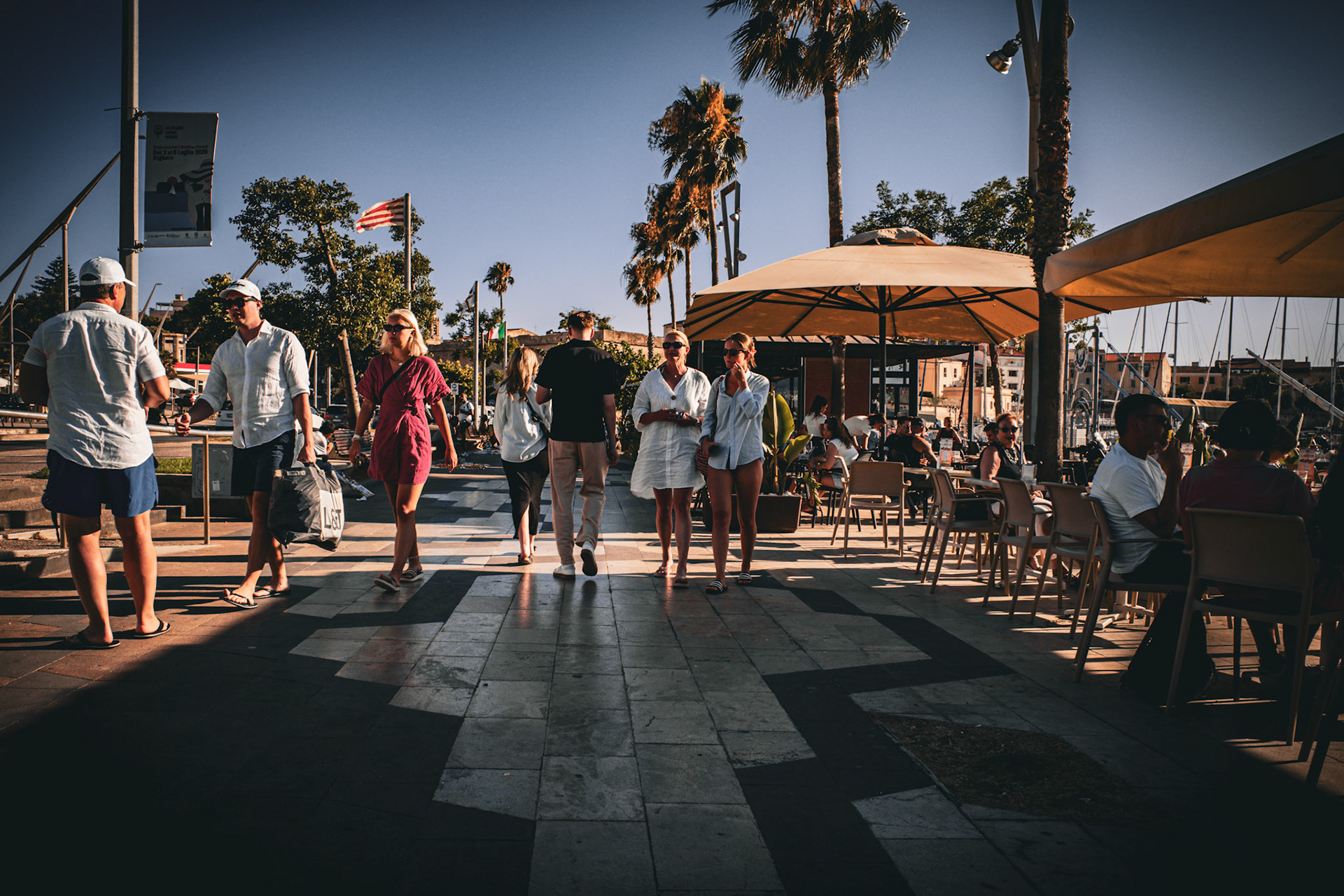 Shadows and laughter by the marina