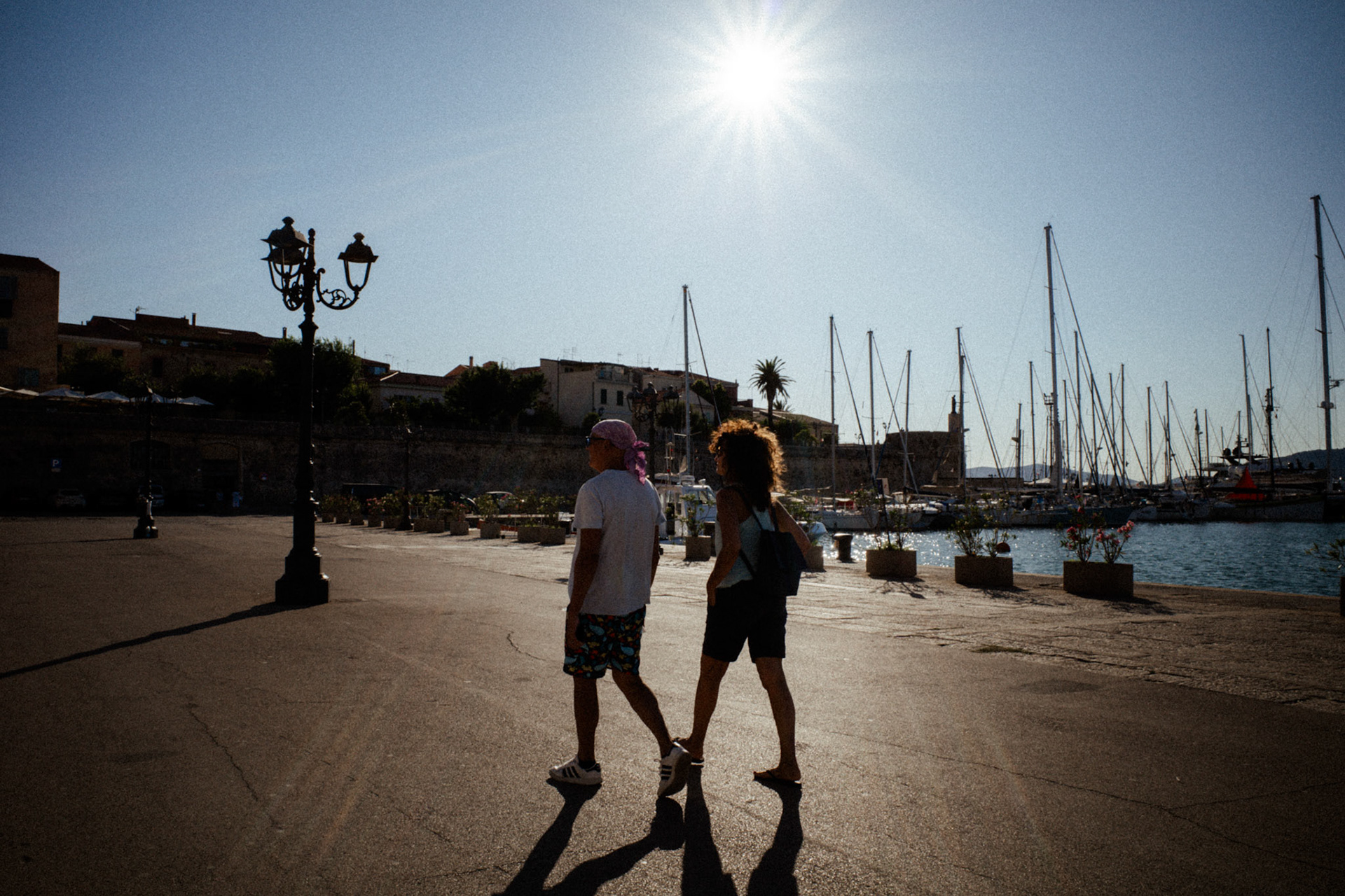 Shadows walking by the sea