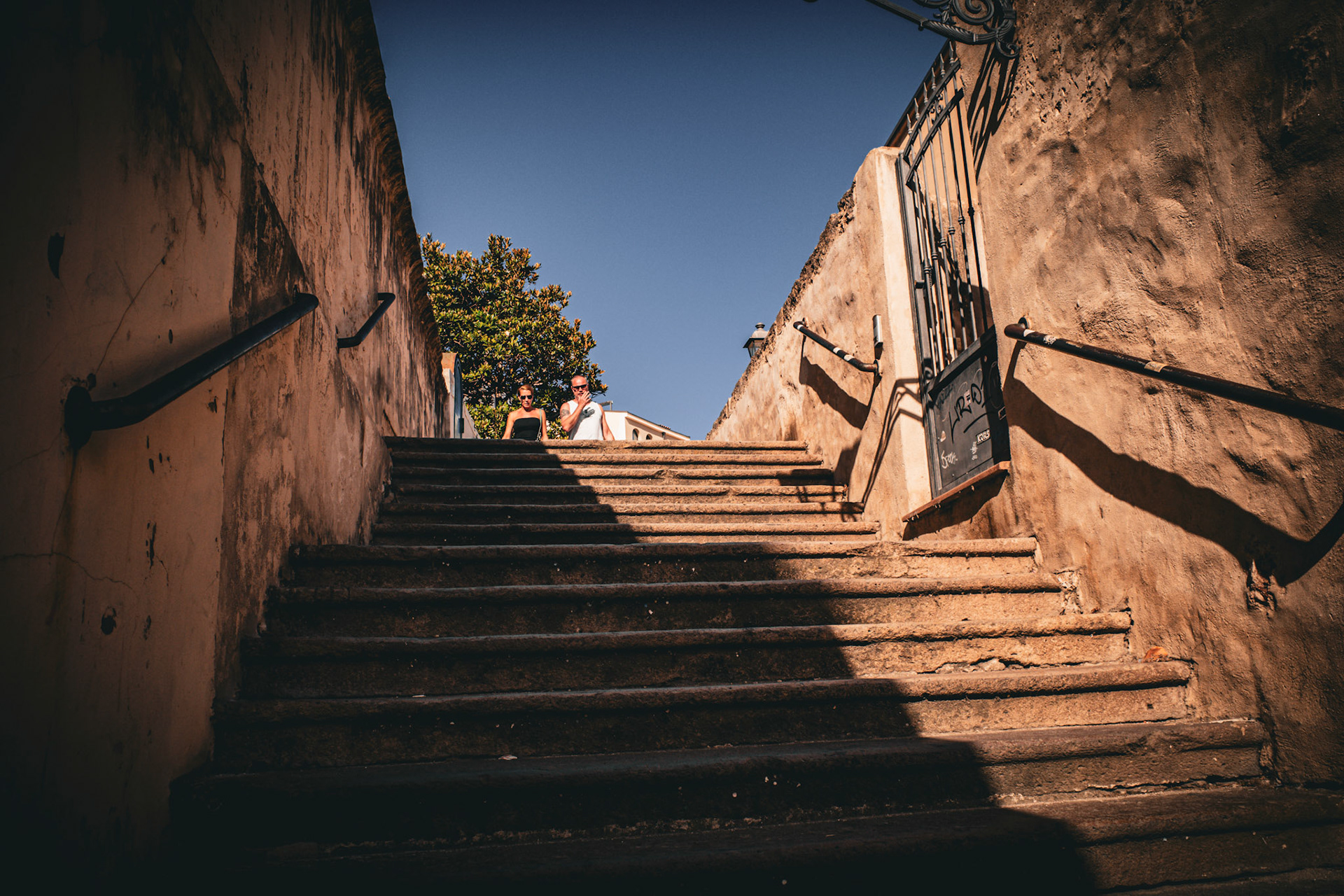 Where the shadows pause before the sky