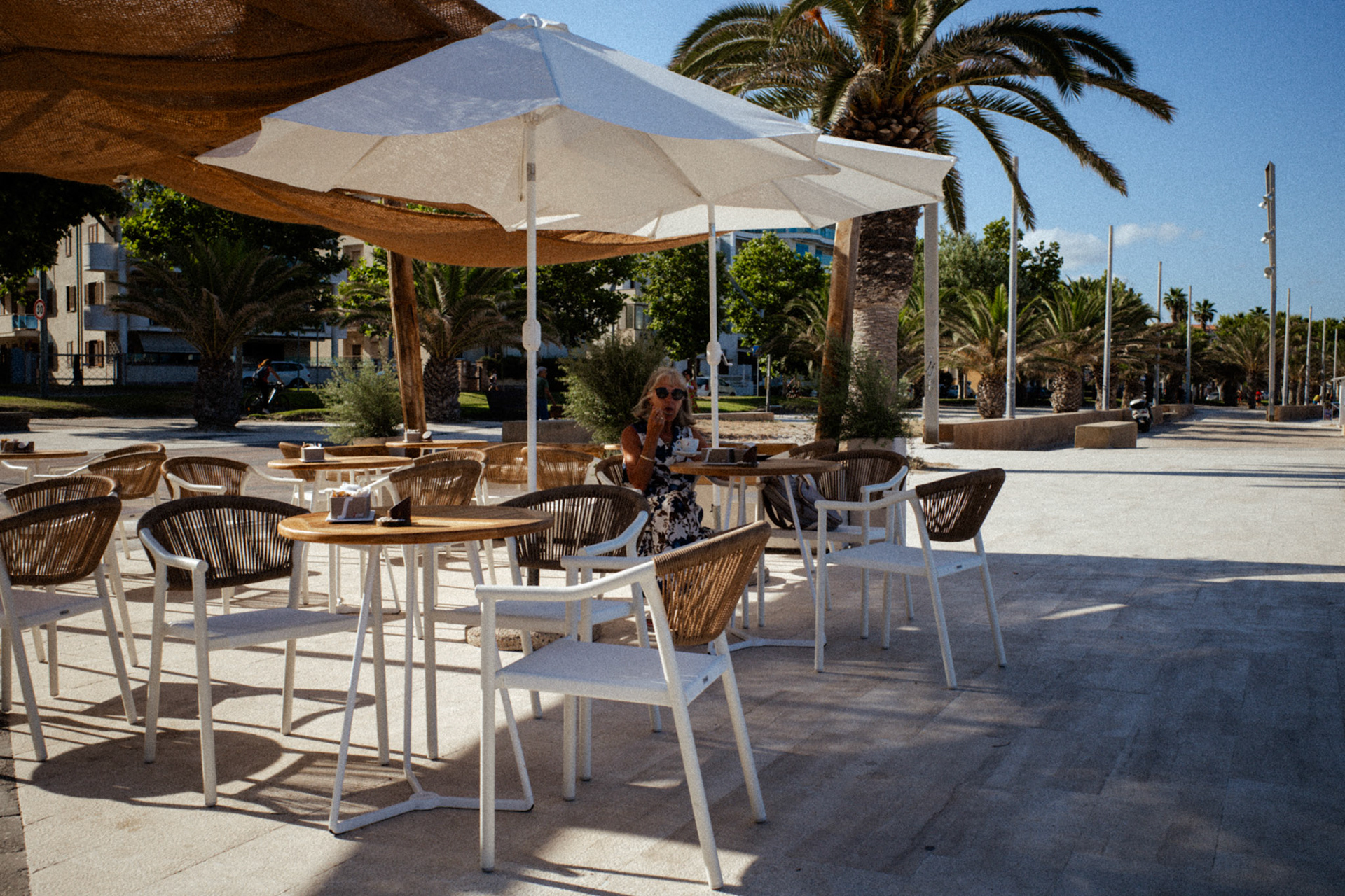 Under the white parasol