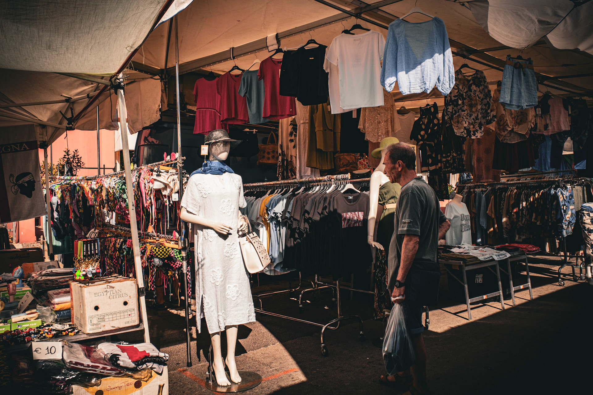 The mannequin waits under the su