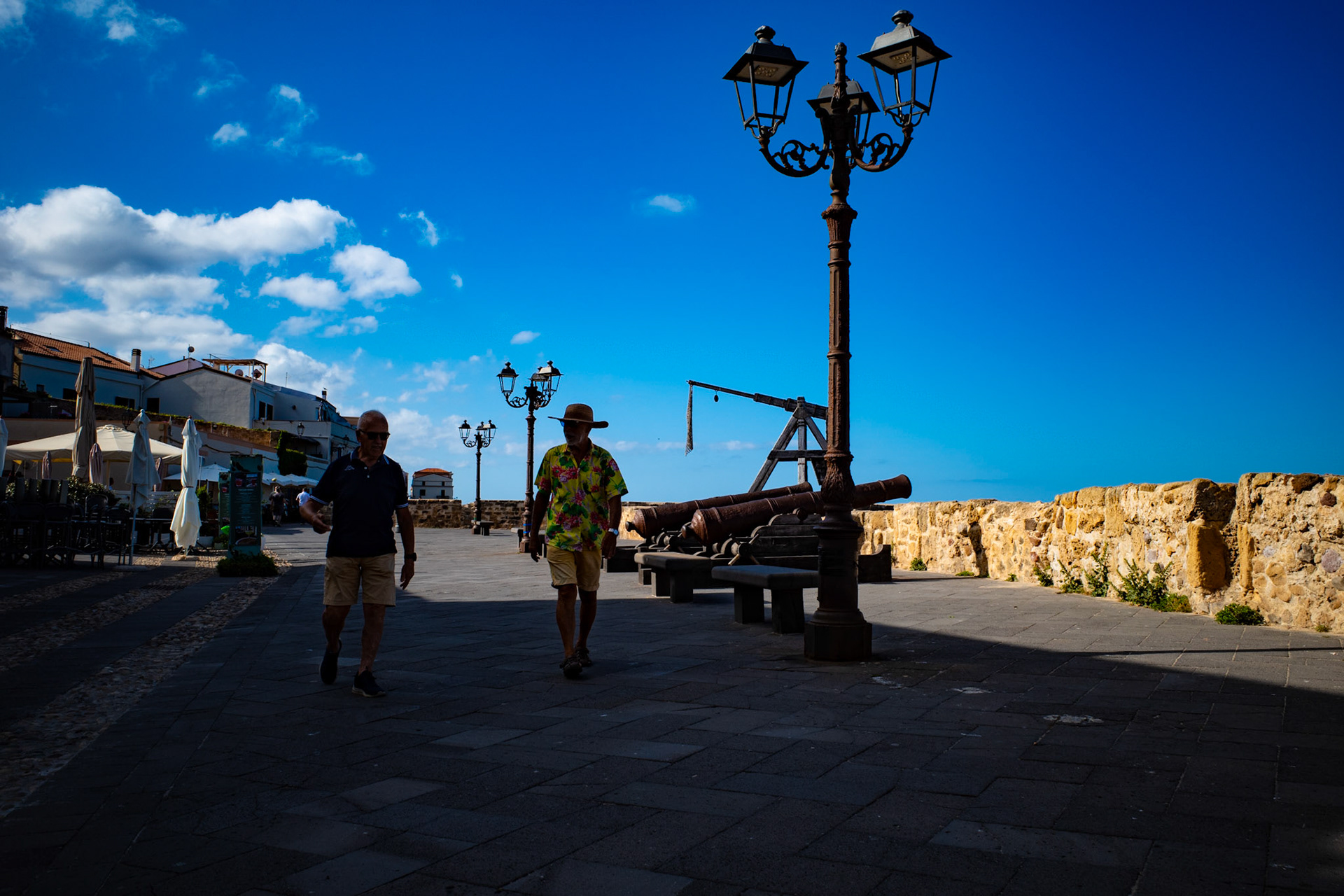 Shadows walking under a blue silence