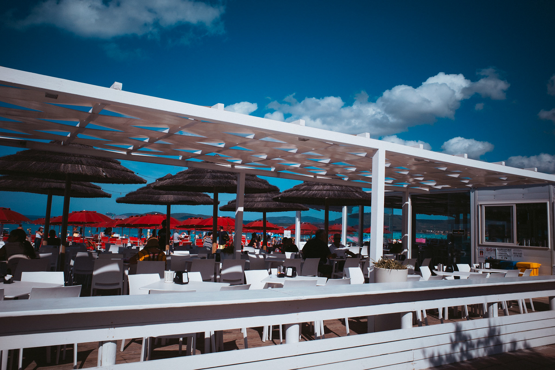 Whispers under the red umbrellas