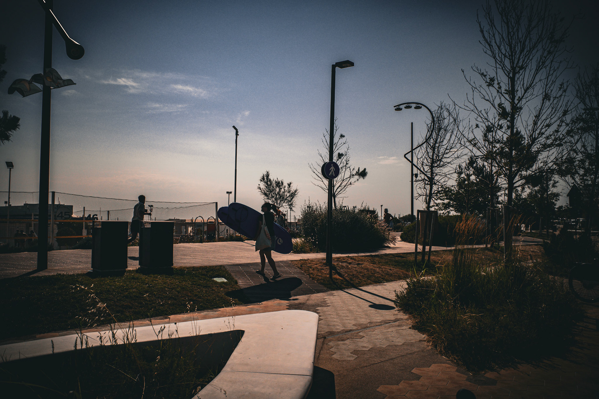 She walks the line between asphalt and tide