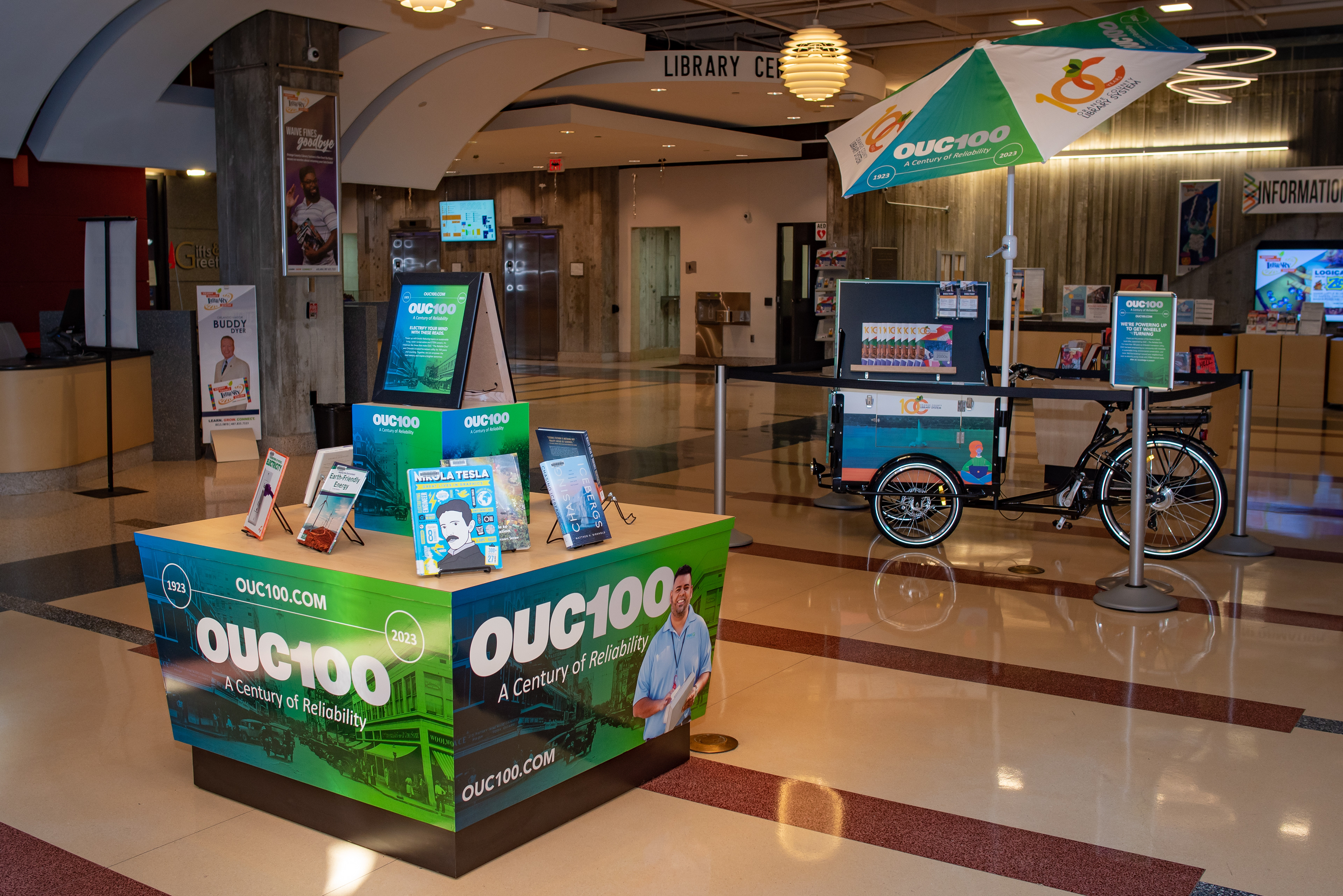 OUC100 Book Bike + Lobby Display at the Orange County Library