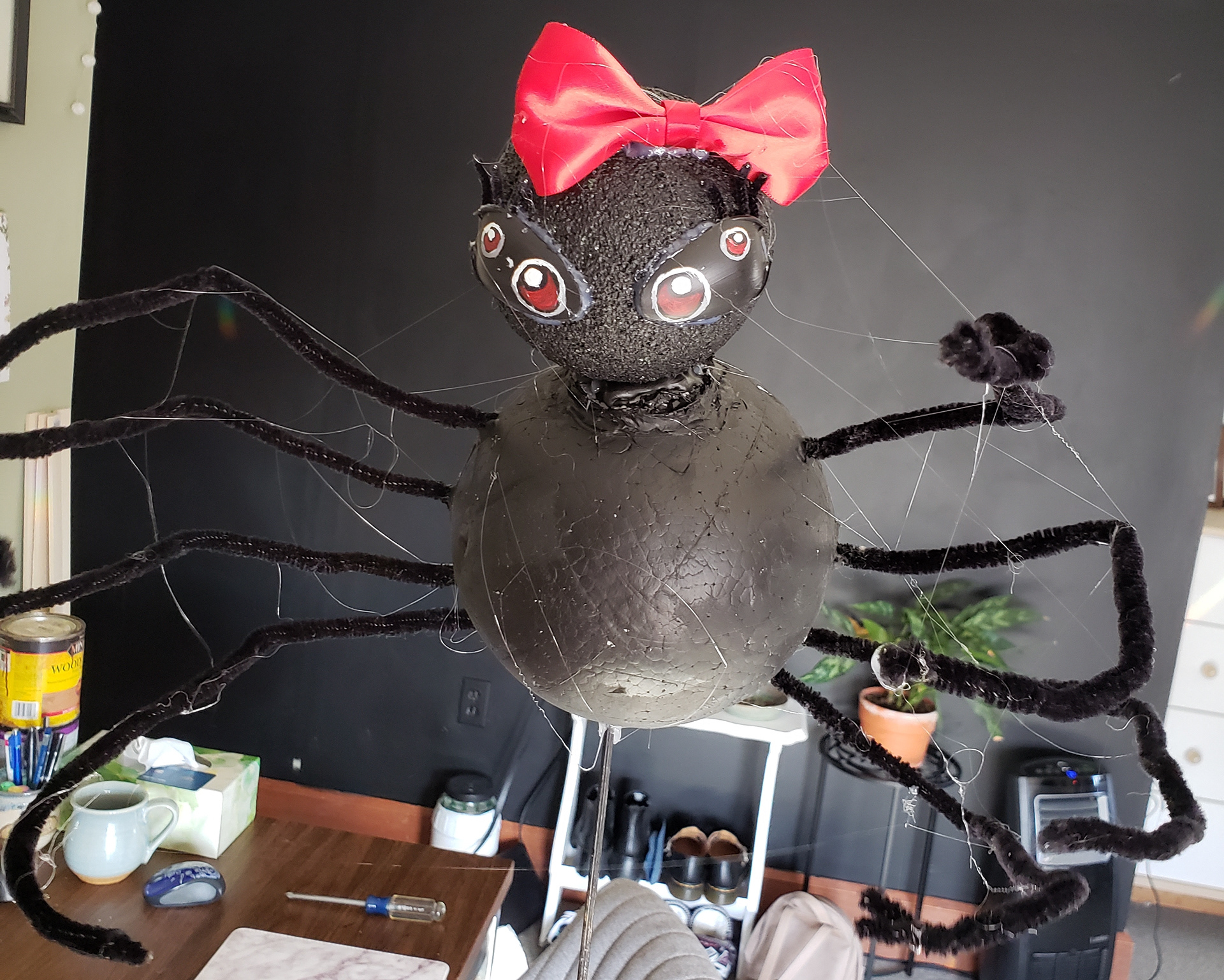 Used hot glue to create the spider webs on spider prop.