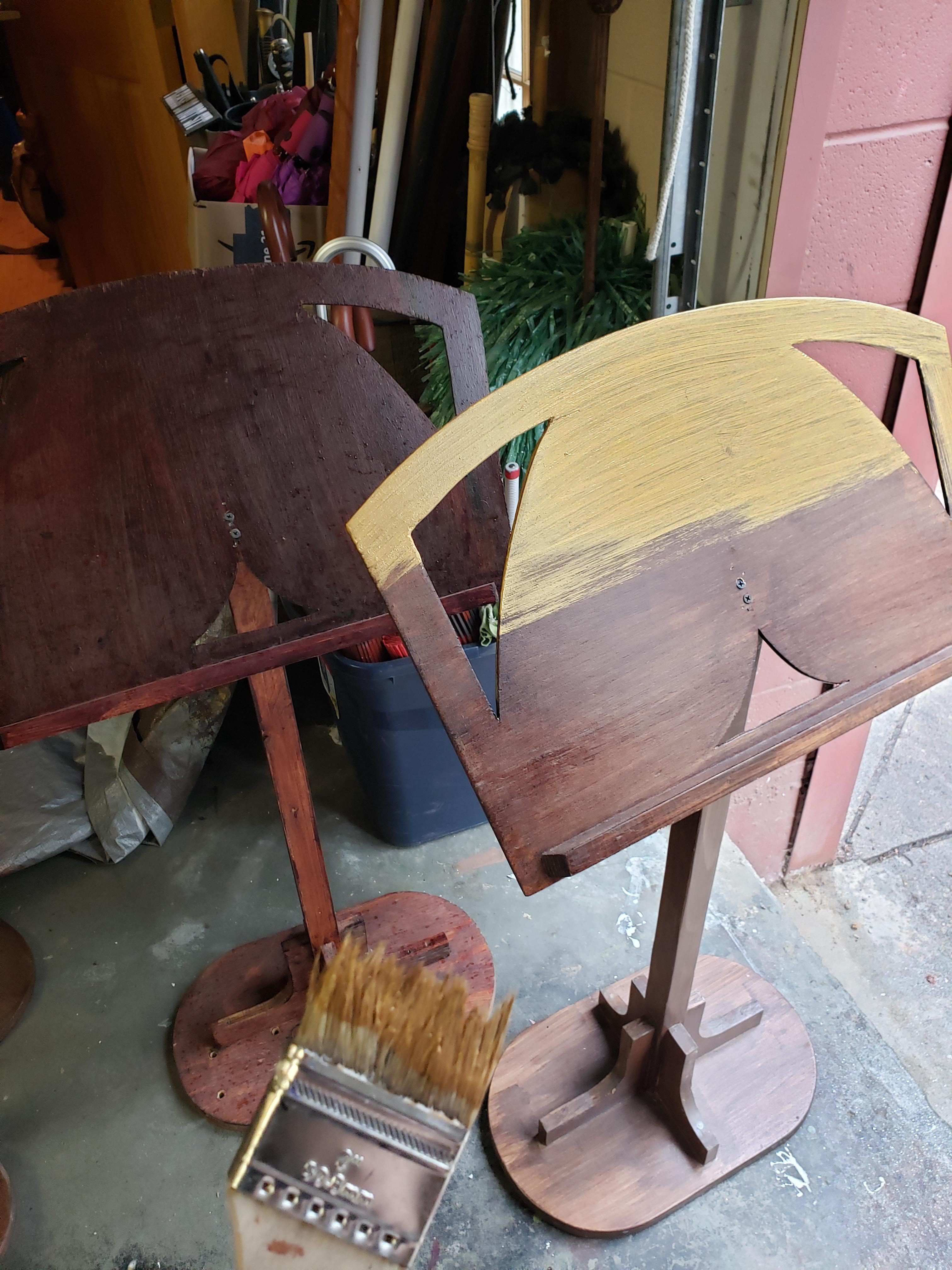 Painted a series of music stands to match chairs which were also painted gold and sealed with polyurethane to prevent gold from rubbing onto costumes.