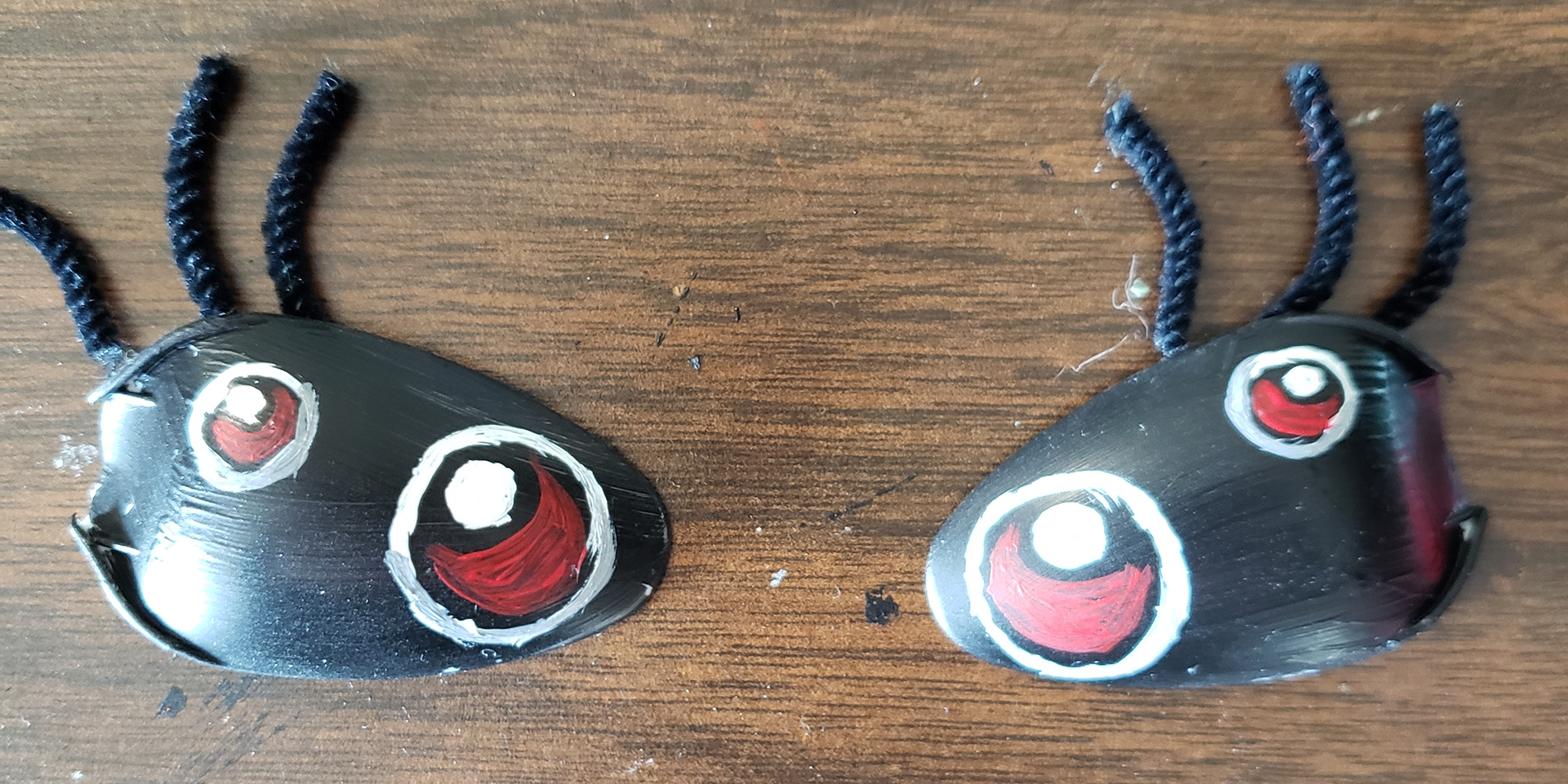Made eyes out of spoons for their shape.