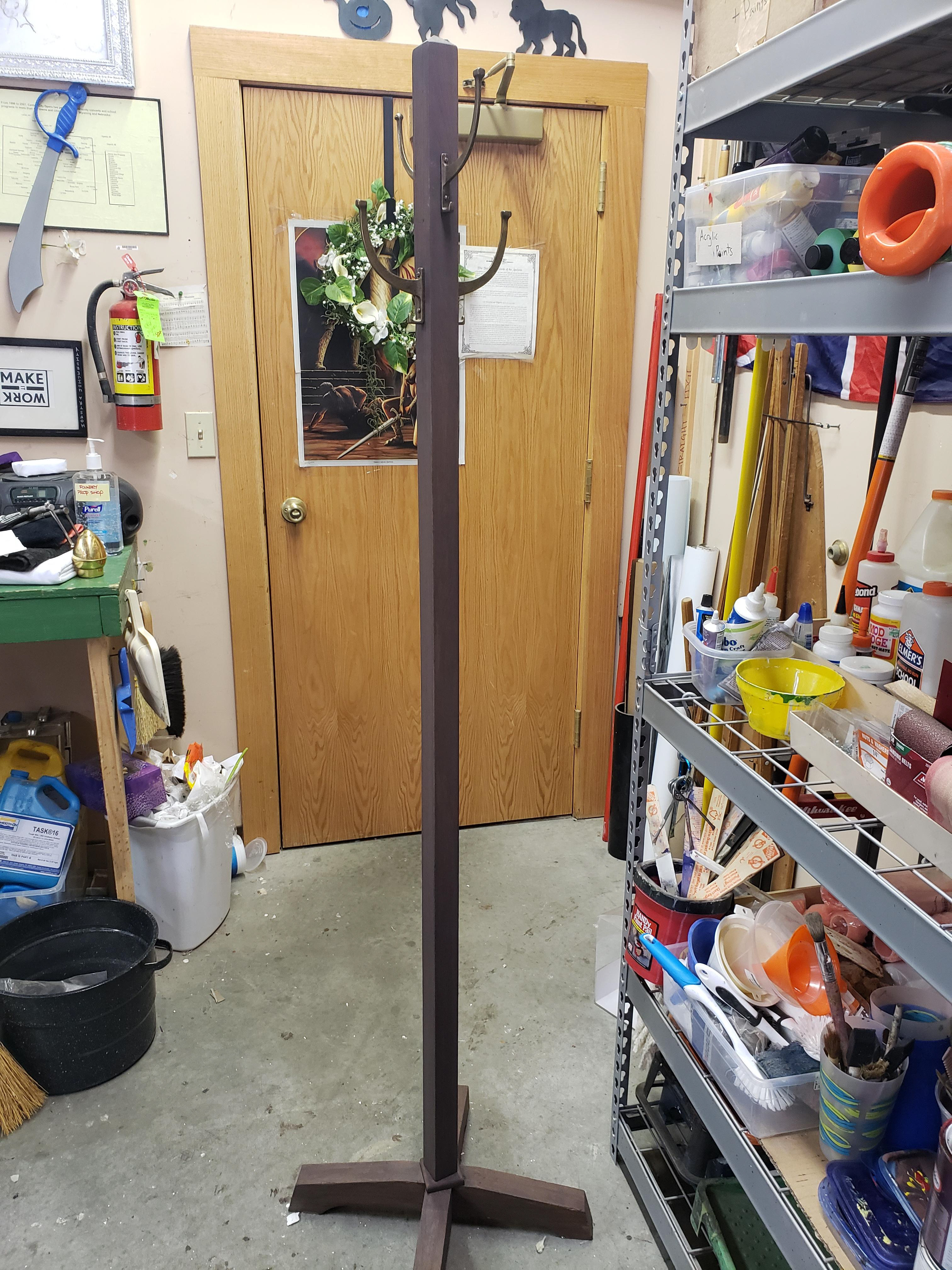 Discolored coat rack to fit in with the rest of the jail scene furniture using watered down paint.