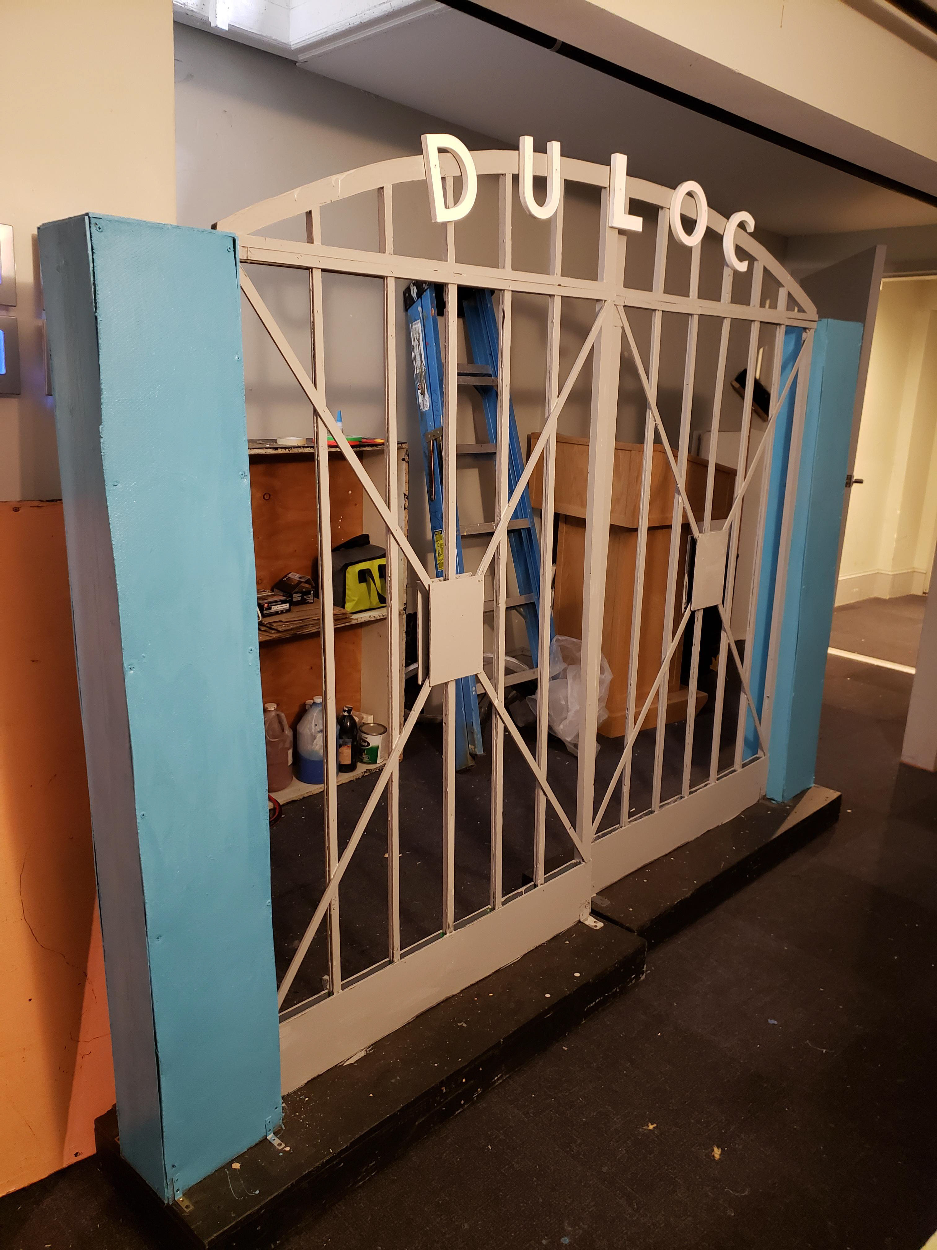 Repainted existing gates for Duloc and added lettering.