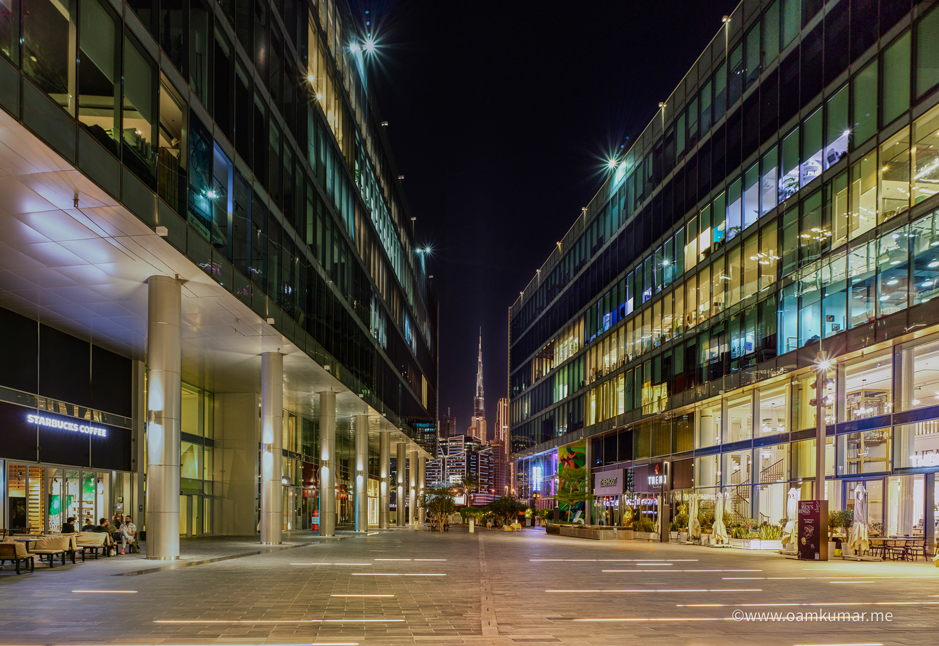 Dubai Design District (D3) exterior captured by architectural photographer Oamkumar – modern glass façade in golden hour lighting.