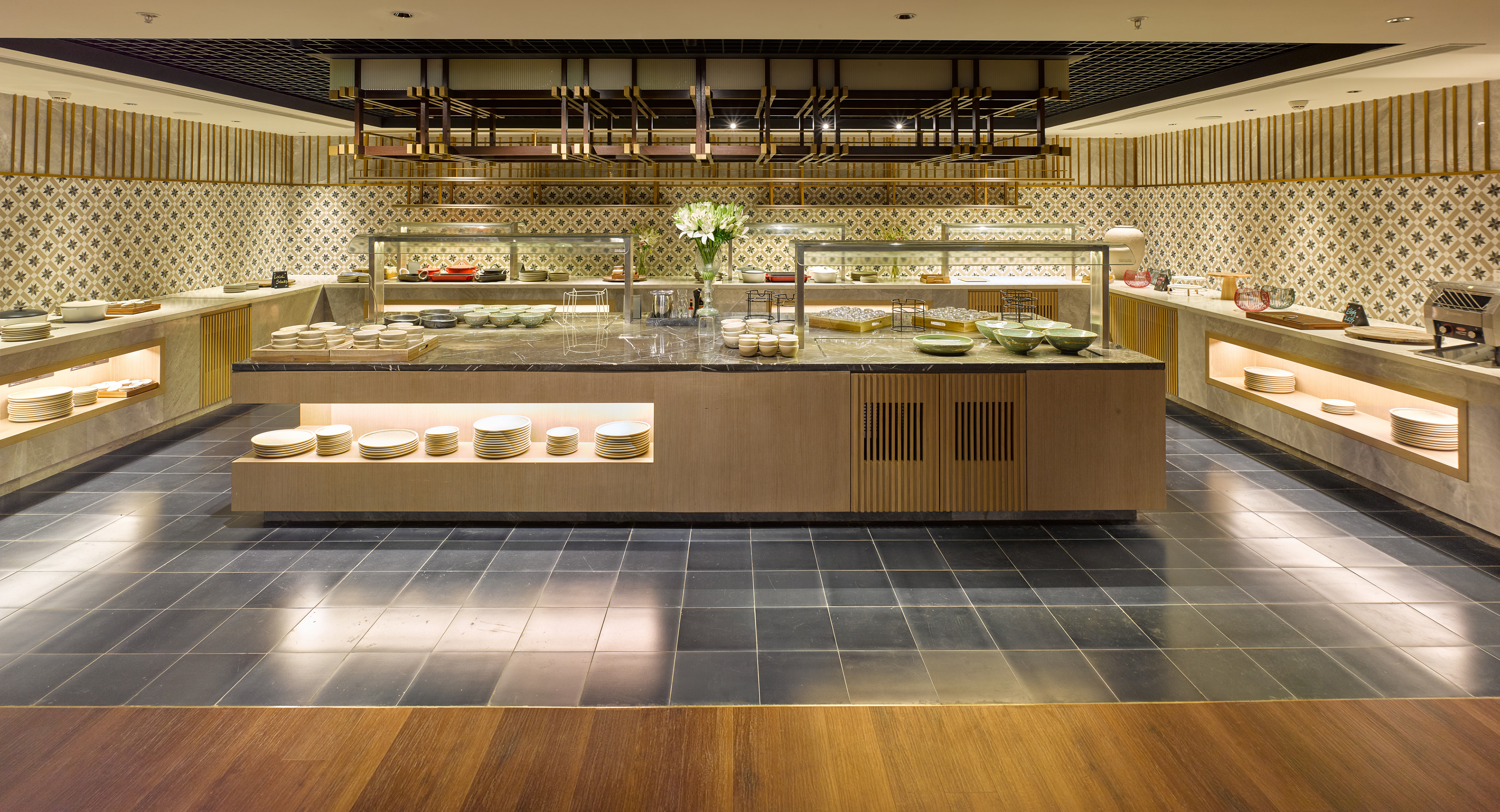 Chic restaurant at Taj Hotel near Cochin International Airport, featuring stylish interiors, ambient lighting, and a fine dining setup, photographed by Oamkumar Thottungal.