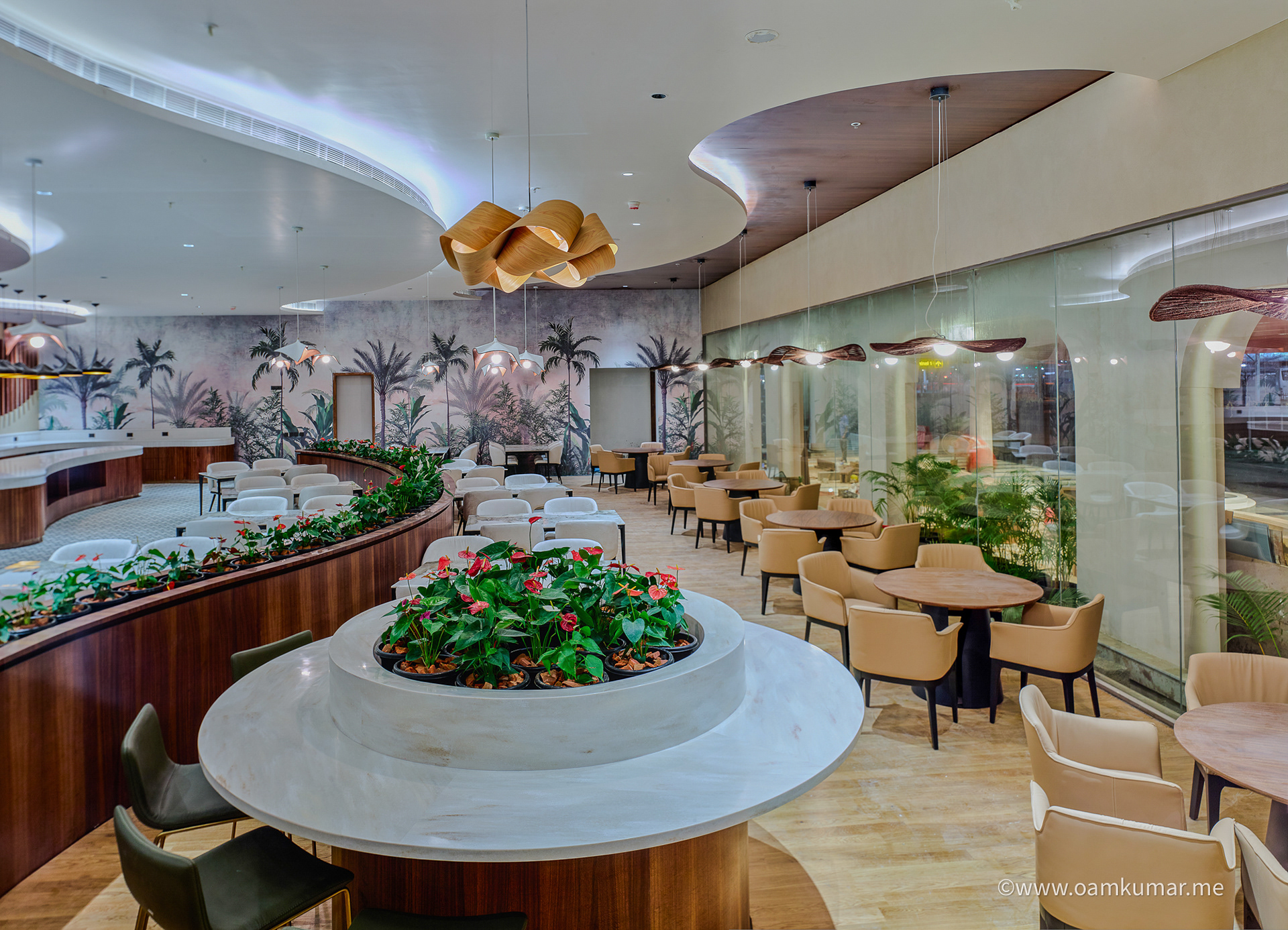 Full view of stylish restaurant in the '0484' lounge at Cochin International Airport Ltd (CIAL), showcasing elegant decor, cozy seating, and a premium dining experience, photographed by Oamkumar Thottungal.