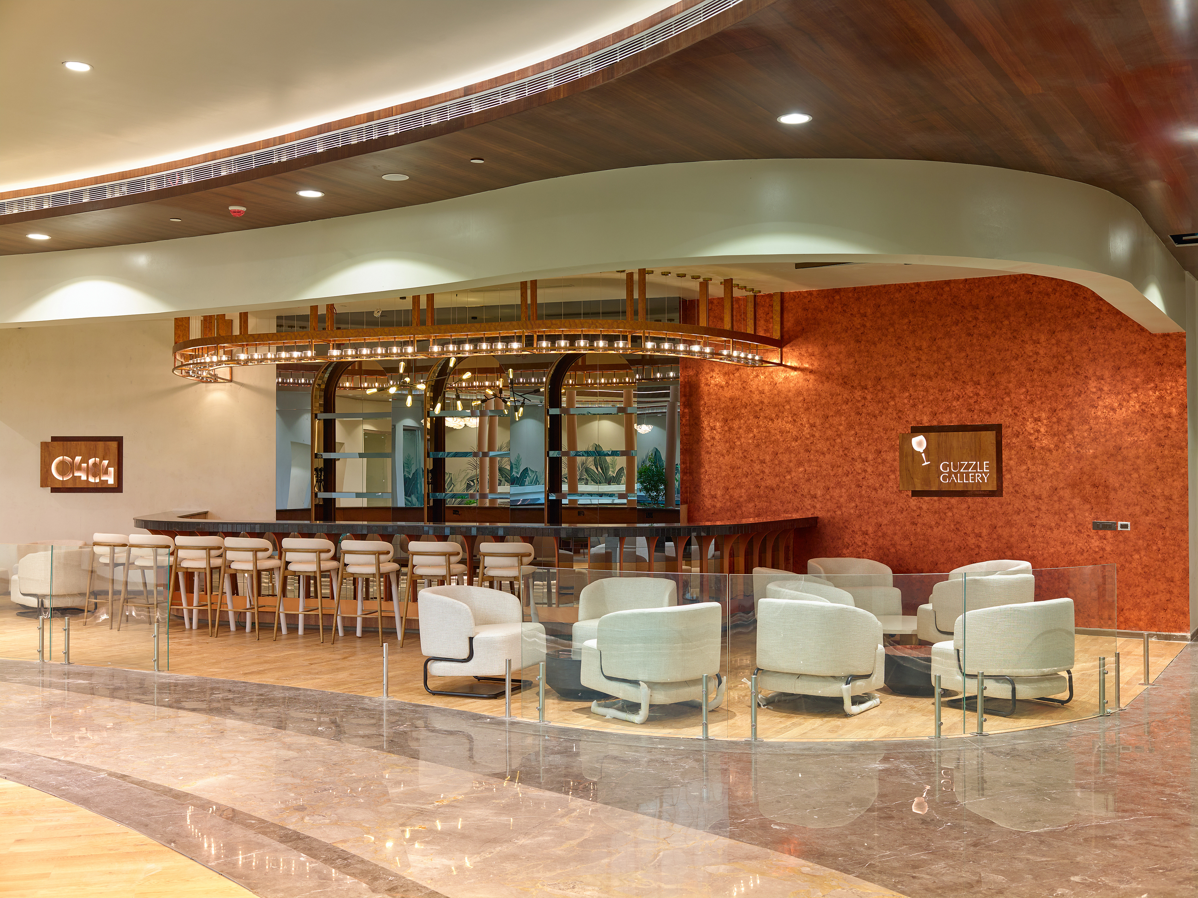 Contemporary bar in the '0484' lounge at Cochin International Airport Ltd (CIAL), featuring a sleek counter, ambient lighting, and a sophisticated atmosphere, photographed by Oamkumar Thottungal.