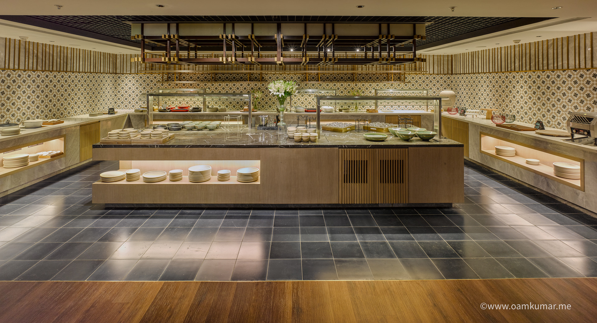 Chic restaurant at Taj Hotel near Cochin International Airport, featuring stylish interiors, ambient lighting, and a fine dining setup, photographed by Oamkumar Thottungal.