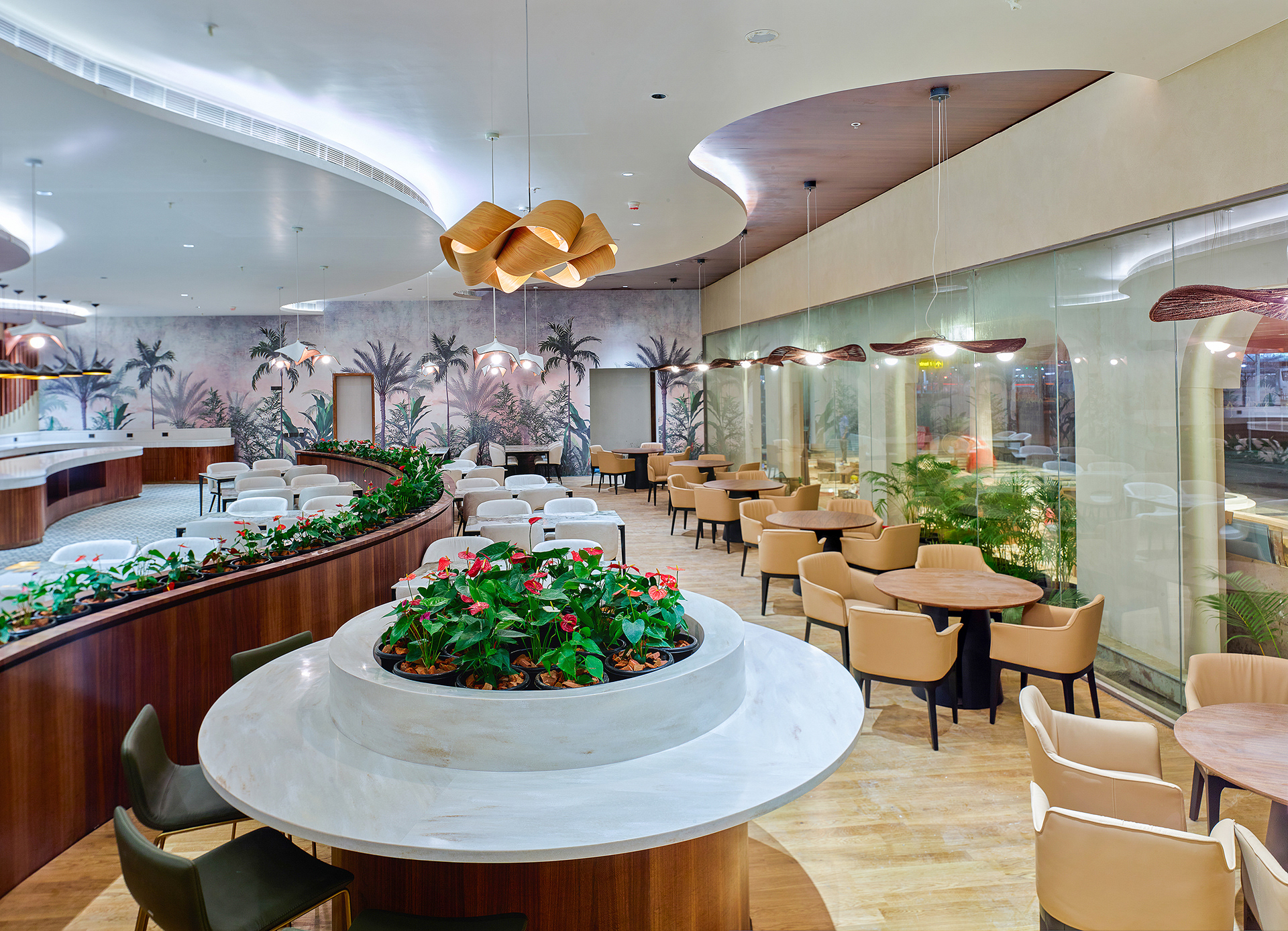 Full view of stylish restaurant in the '0484' lounge at Cochin International Airport Ltd (CIAL), showcasing elegant decor, cozy seating, and a premium dining experience, photographed by Oamkumar Thottungal.