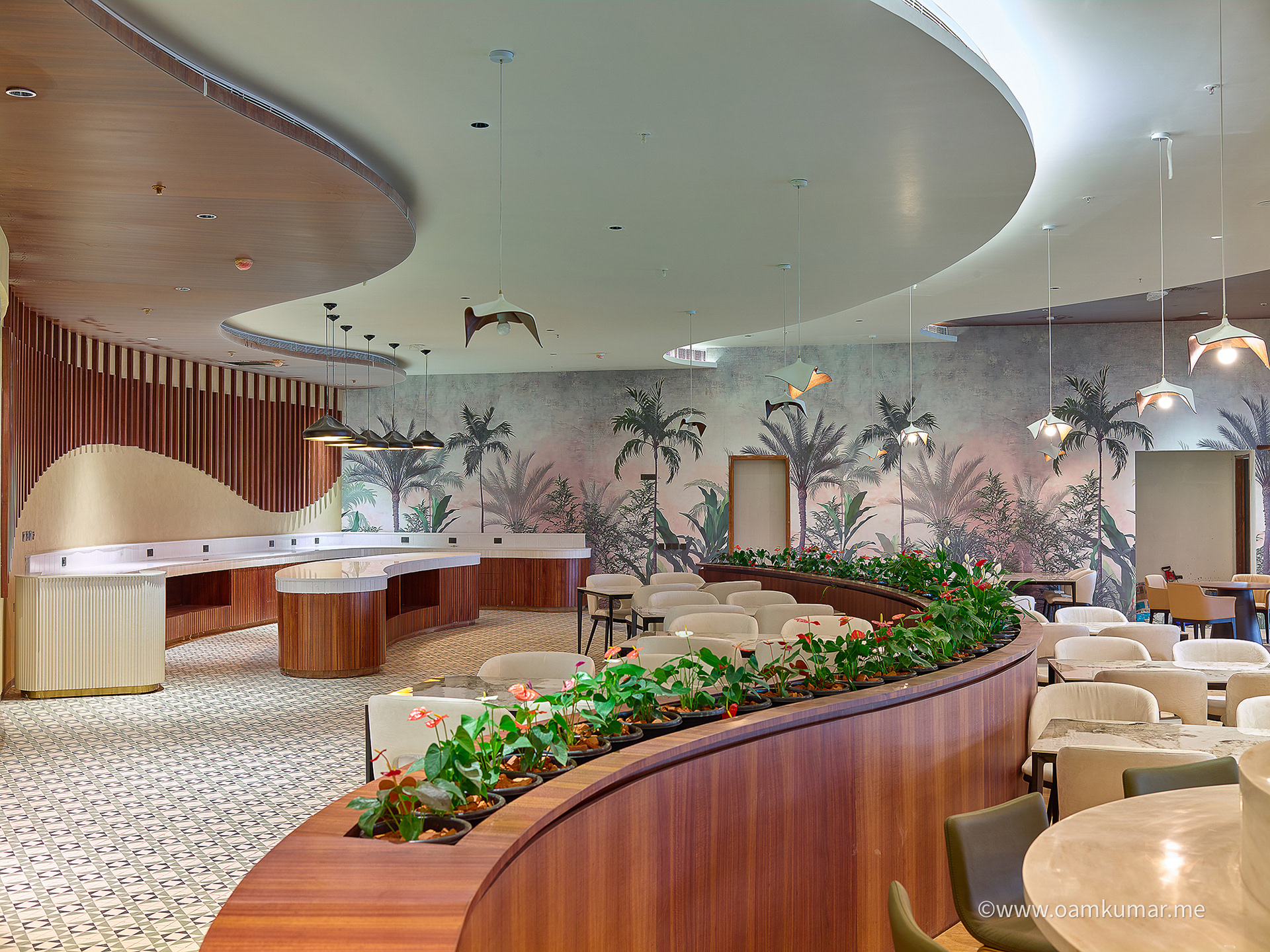 Stylish restaurant in the '0484' lounge at Cochin International Airport Ltd (CIAL), showcasing elegant decor, cozy seating, and a premium dining experience, photographed by Oamkumar Thottungal.