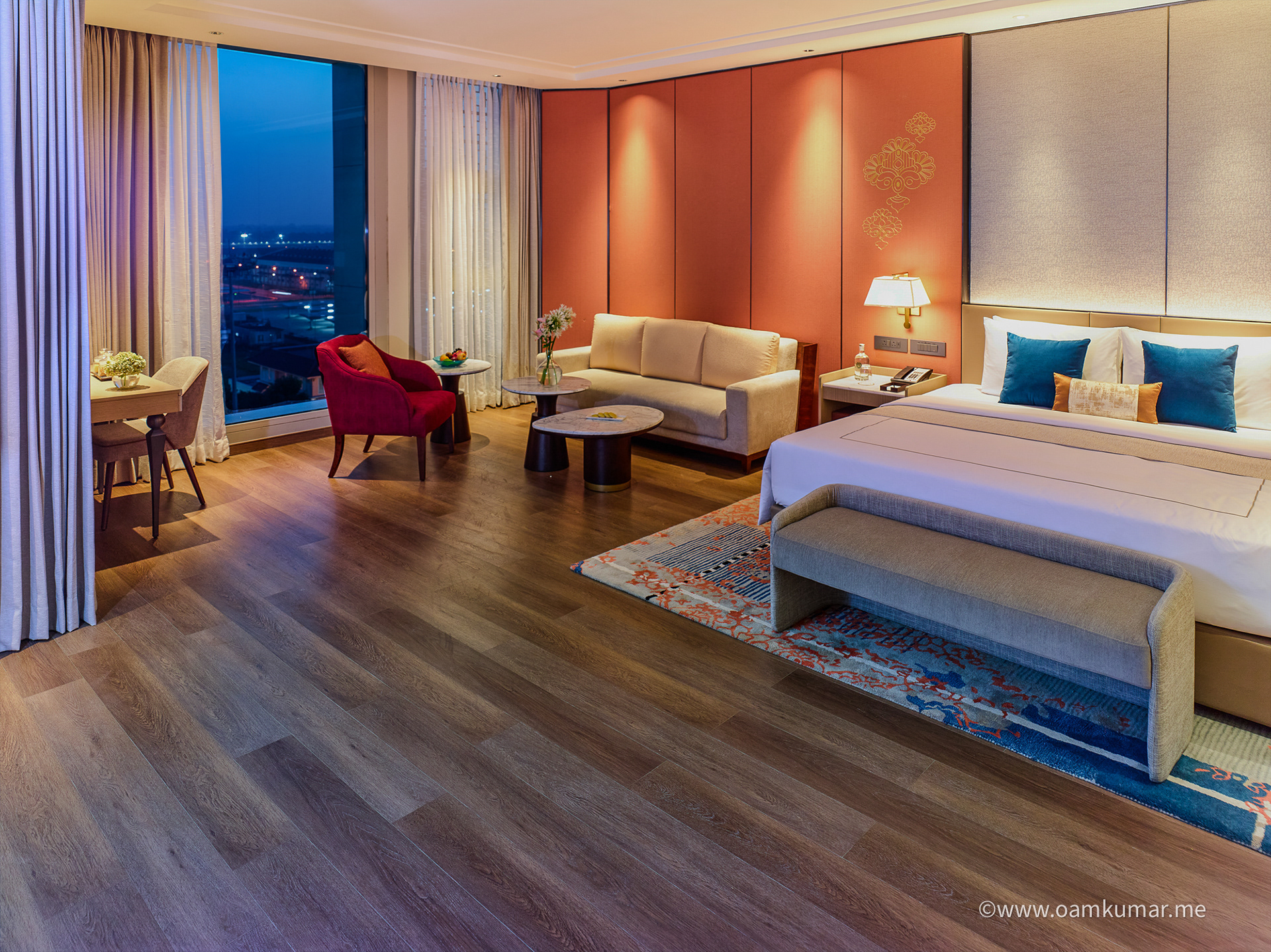 Luxurious double room at Taj Hotel near Cochin International Airport, featuring modern furnishings, a cozy ambiance, and a stunning airport view, photographed by Oamkumar Thottungal.