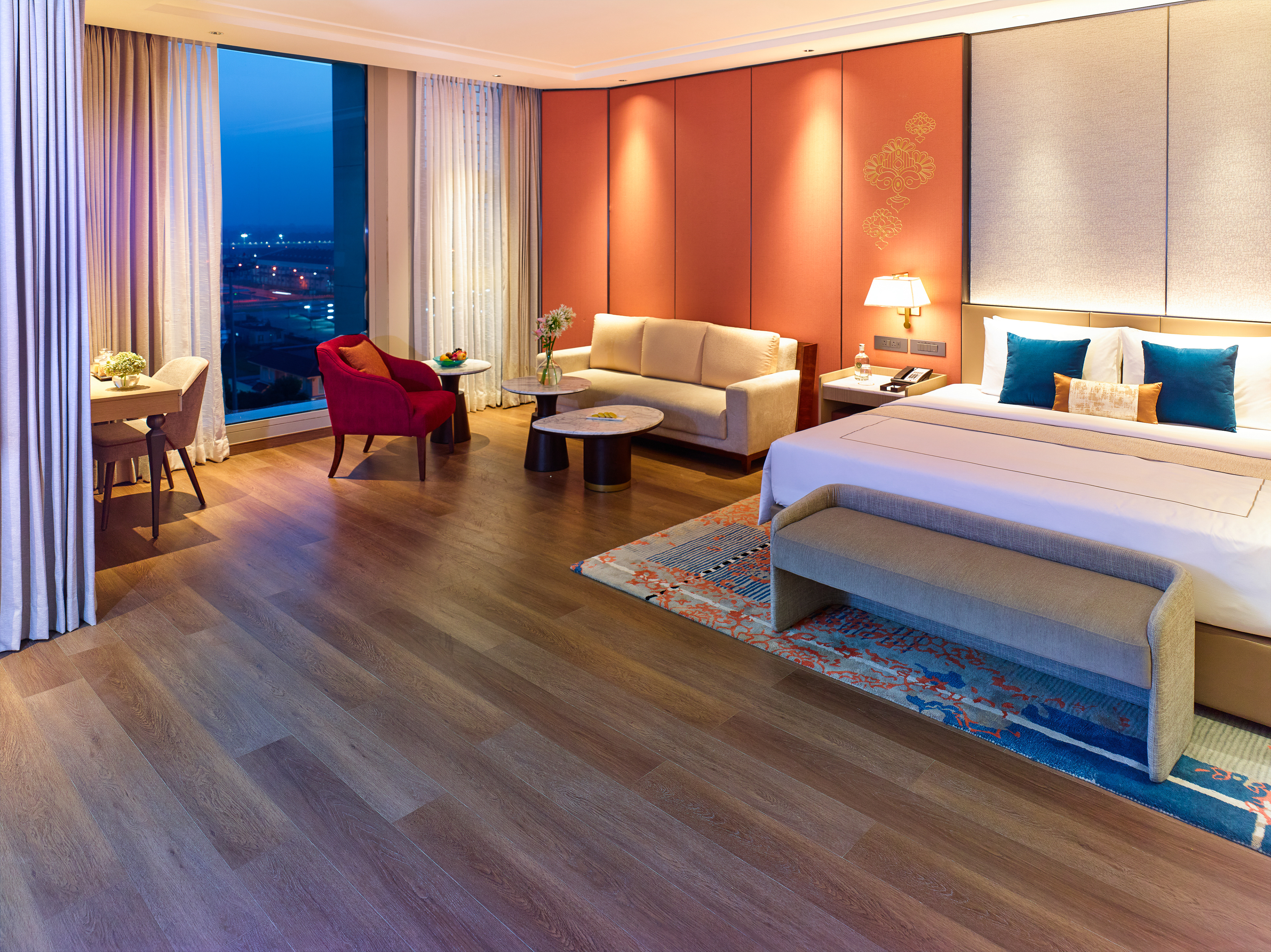 Luxurious double room at Taj Hotel near Cochin International Airport, featuring modern furnishings, a cozy ambiance, and a stunning airport view, photographed by Oamkumar Thottungal.