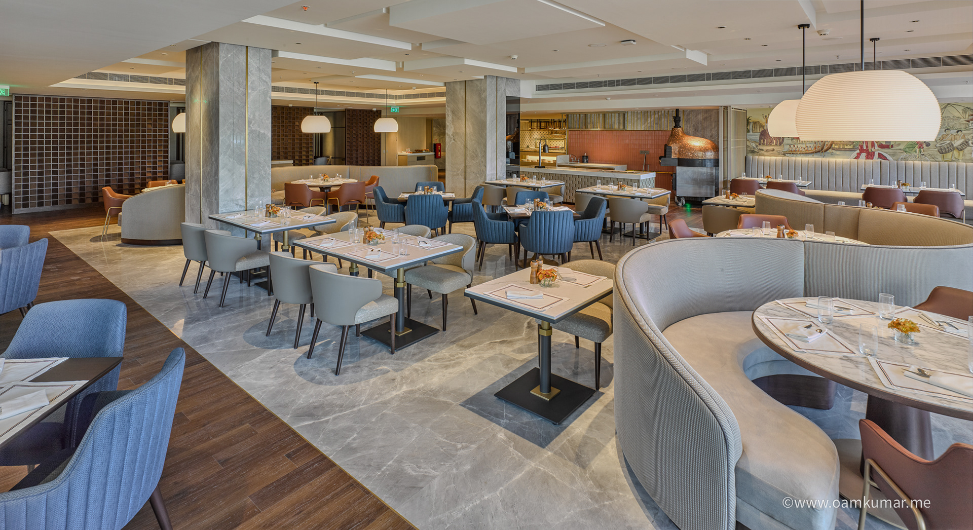 Restaurant interior of Taj Hotel near Cochin International Airport – luxury architecture captured by photographer Oamkumar with natural lighting and grand spatial composition.