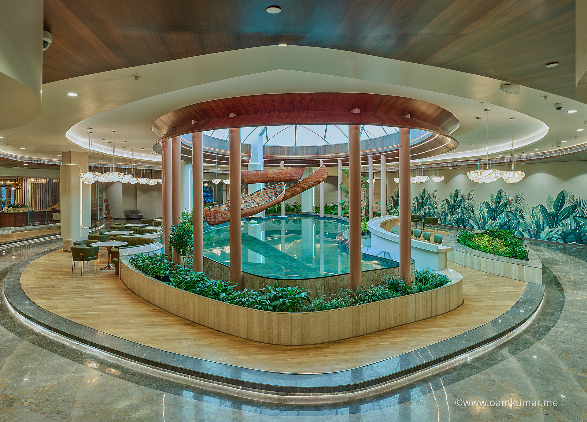 Full view of stylish lobby in the '0484' lounge at Cochin International Airport Ltd (CIAL), showcasing elegant decor, cozy seating, and a premium dining experience, photographed by Oamkumar Thottungal.