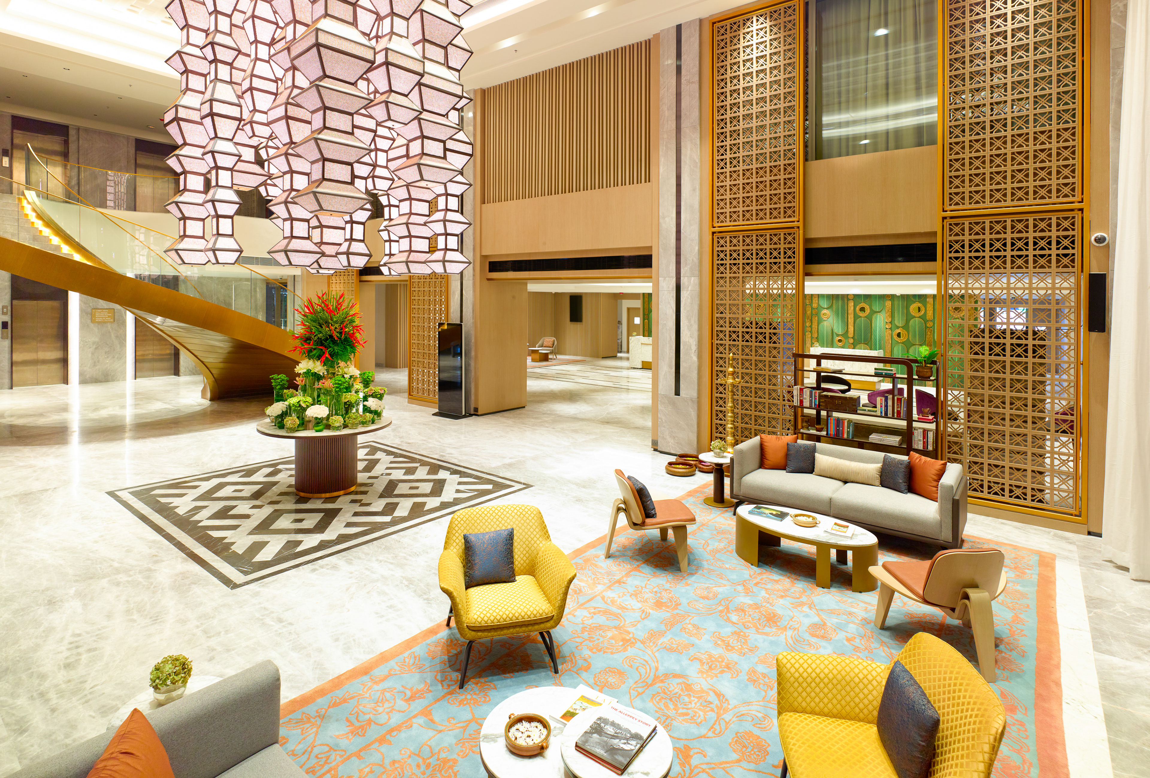 Elegant lobby of Taj Hotel near Cochin International Airport, showcasing luxurious interiors with warm lighting and modern decor, photographed by Oamkumar Thottungal.