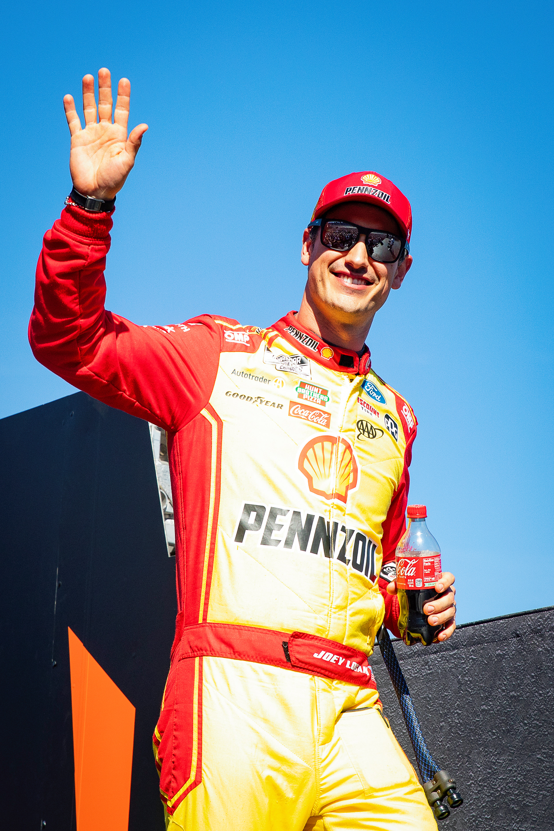 Joey Lagano waves to the crowd during driver introductions before the NASCAR Cup Series Championship Race at Phoenix Raceway, Nov. 2. 