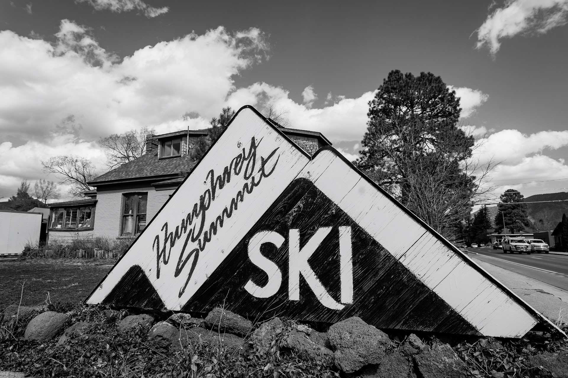 The sign for the Humphrey Ski Summit in Flagstaff.  This whole day shooting was really nice weather for me trying to shoot black and white. The clouds were out in full force creating a really nice diffused light that made the trees as well as the texture on the sign pop super well. I loved the balance I was able to get with the black part of the ski sign as well as the whites that are in the clouds. A really nice balanced photo that I think would make for a really nice advertising photo. Shot on the Sigma 20mm f/1.4 Art lens. March 5, 2026.   