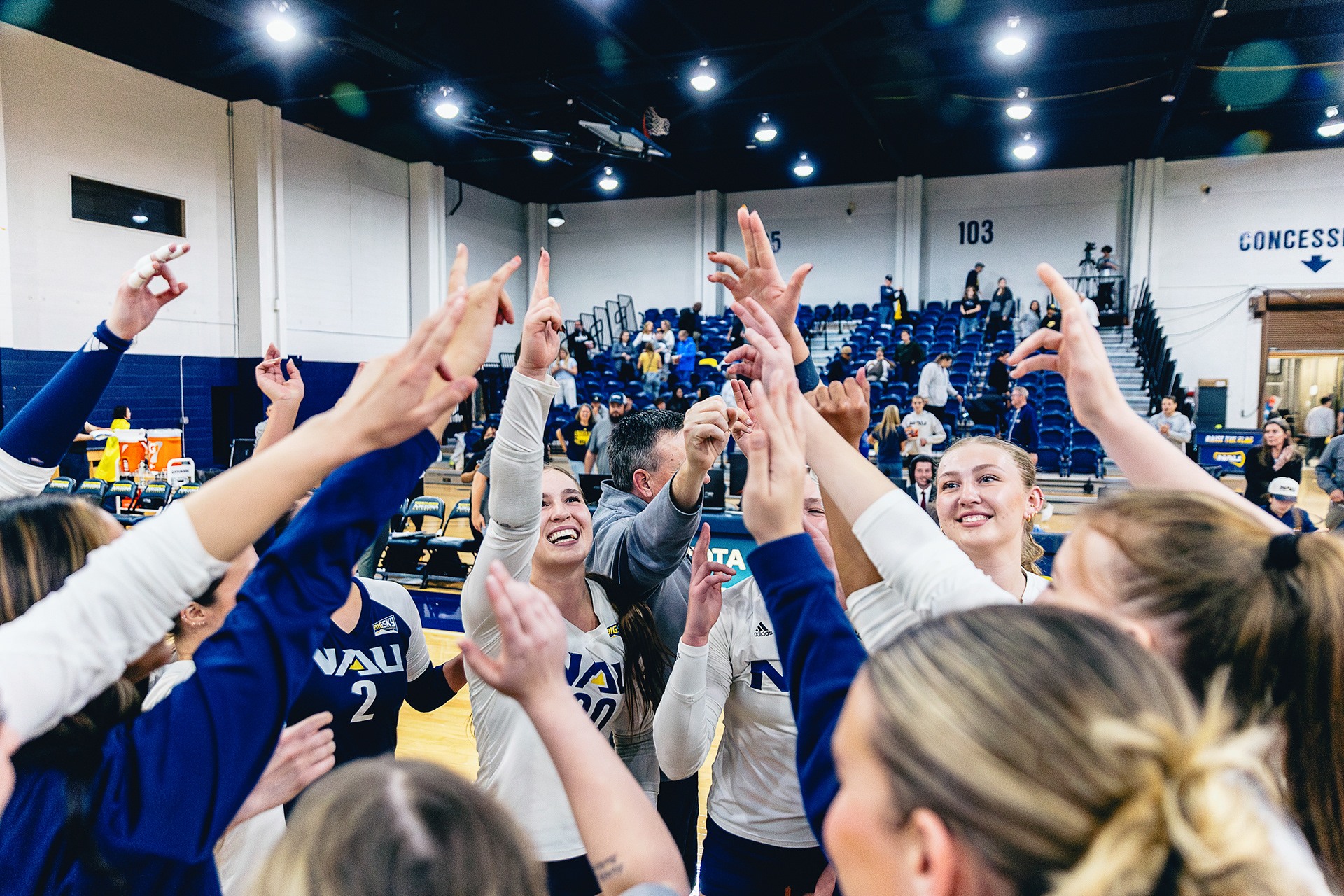 The NAU Women's Volleyball Team celebrates completeing the reverse sweep against Big Sky Conference foe Weber State at The Rolle Activity Center, Nov. 13. 