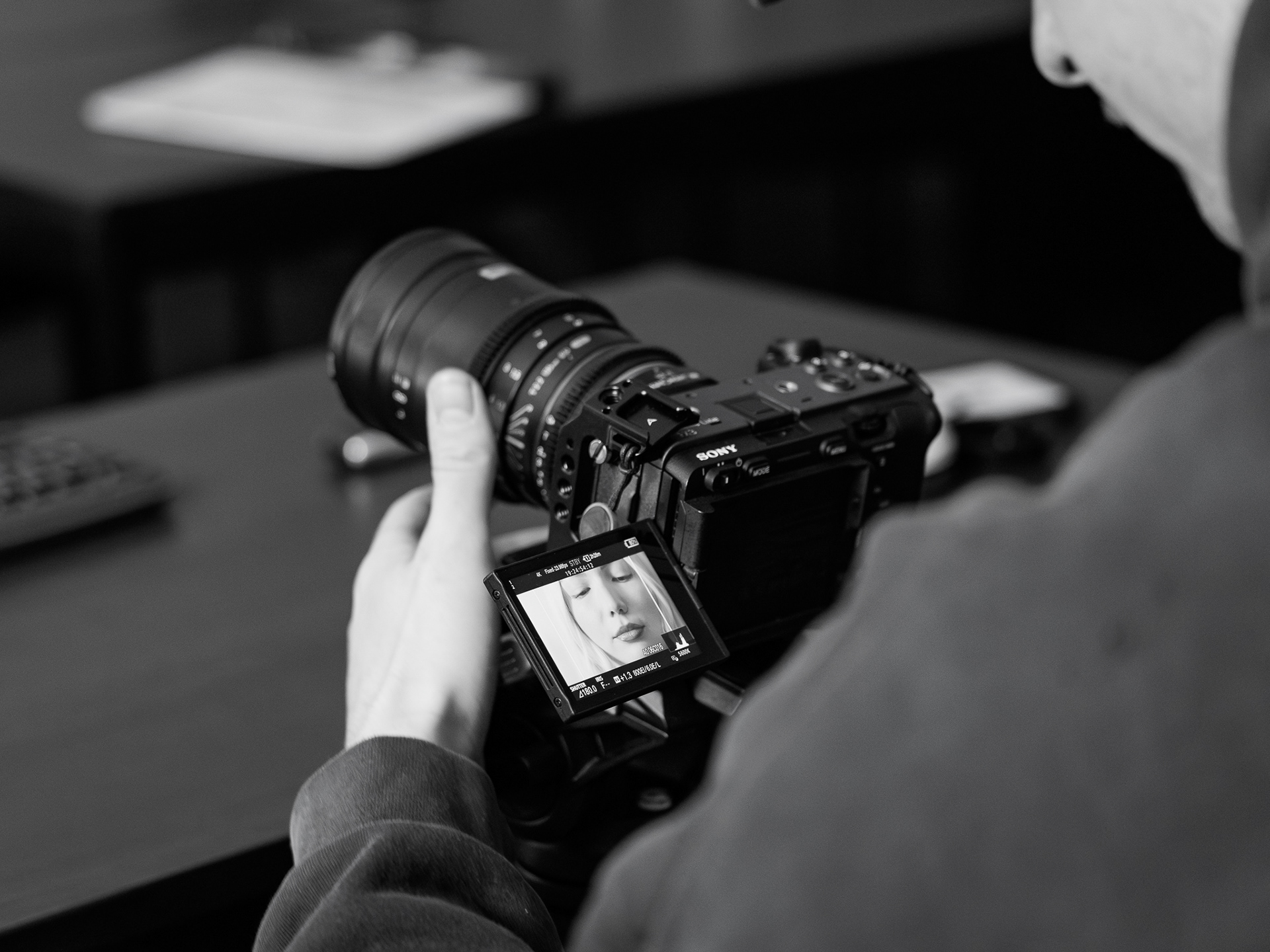 Cinematographer Parker Hall composes a shot during day one of filming We Weren't Meant To Be Saved in Ashurst Auditorium. When I was asked to do set photos for this film, I knew that I wanted to do a mix of tight detail shots as well as wide shots. And I really liked how sharp that this little detail shot came out. It told a mini story that paints a big picture for a film. Taken on the Canon RDF 24-105 f/4.0. March 19, 2026. 