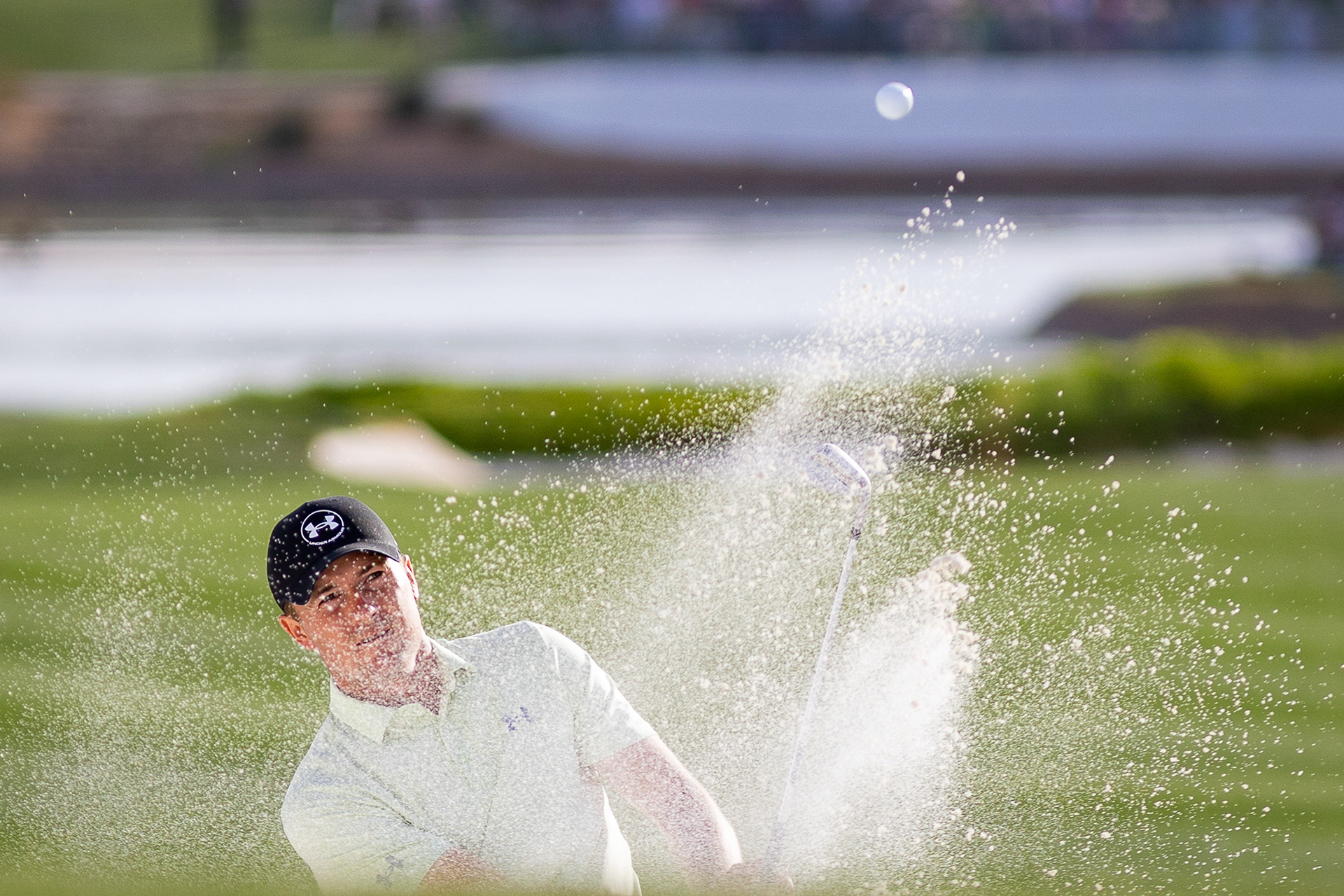 Jordan Speth chips the ball out of the bunker on the 18th hole of the third round of the WM Phoenix Open at TPC Scottsdale, Feb. 8. 
