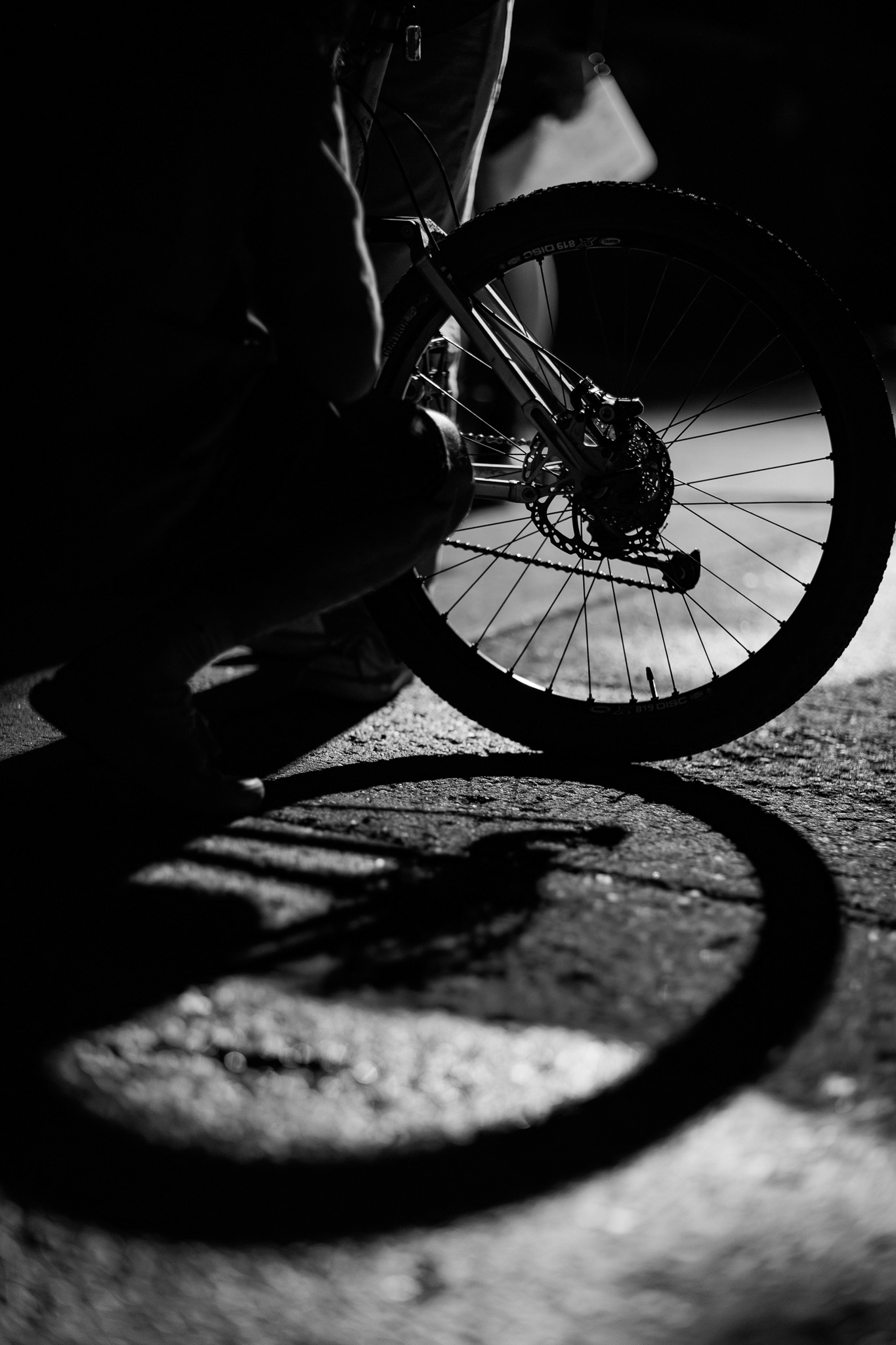 Andy, played by Jackson Murphy, parks his bike at the front of a house on O'Leary Street during day four of filming We Weren't Meant To Be Saved.  Shooting photo on this night was honestly such a challenge. But it was honestly one where I wanted to challenge myself to see things differently. It was around midnight ish when we got to filming this scene. So I knew that the shadows would be harsh and kind of hard to shoot in. But I was able to work around it and find a really cool spot where the light kind of reflected. I really liked how cool and sharp that it came out. Taken on the Canon EF 85mm f/1.2. March 24, 2026. 
