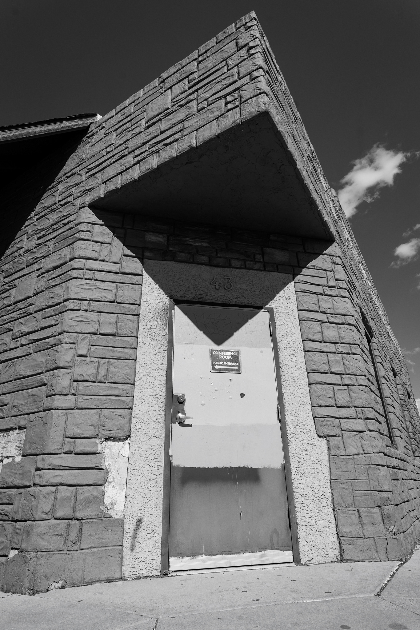 A building makes a wonky shadow in downtown Flagstaff. This photo might be the trippiest one that I took of the whole semester. I really liked how the end of the roof made such a unique shadow. It honestly looks like it is 3D and being folded on top of itself. I also think that the light and the time of day that I went out there and shot this really made the photo. I went back a few days later trying to get something similar but more head on. And it didn't look anywhere close to this. It was one of those once in a lifetime shots that I was so happy that I got. Taken on the Sigma 20mm f/1.4 Art lens. March 5, 2026. 