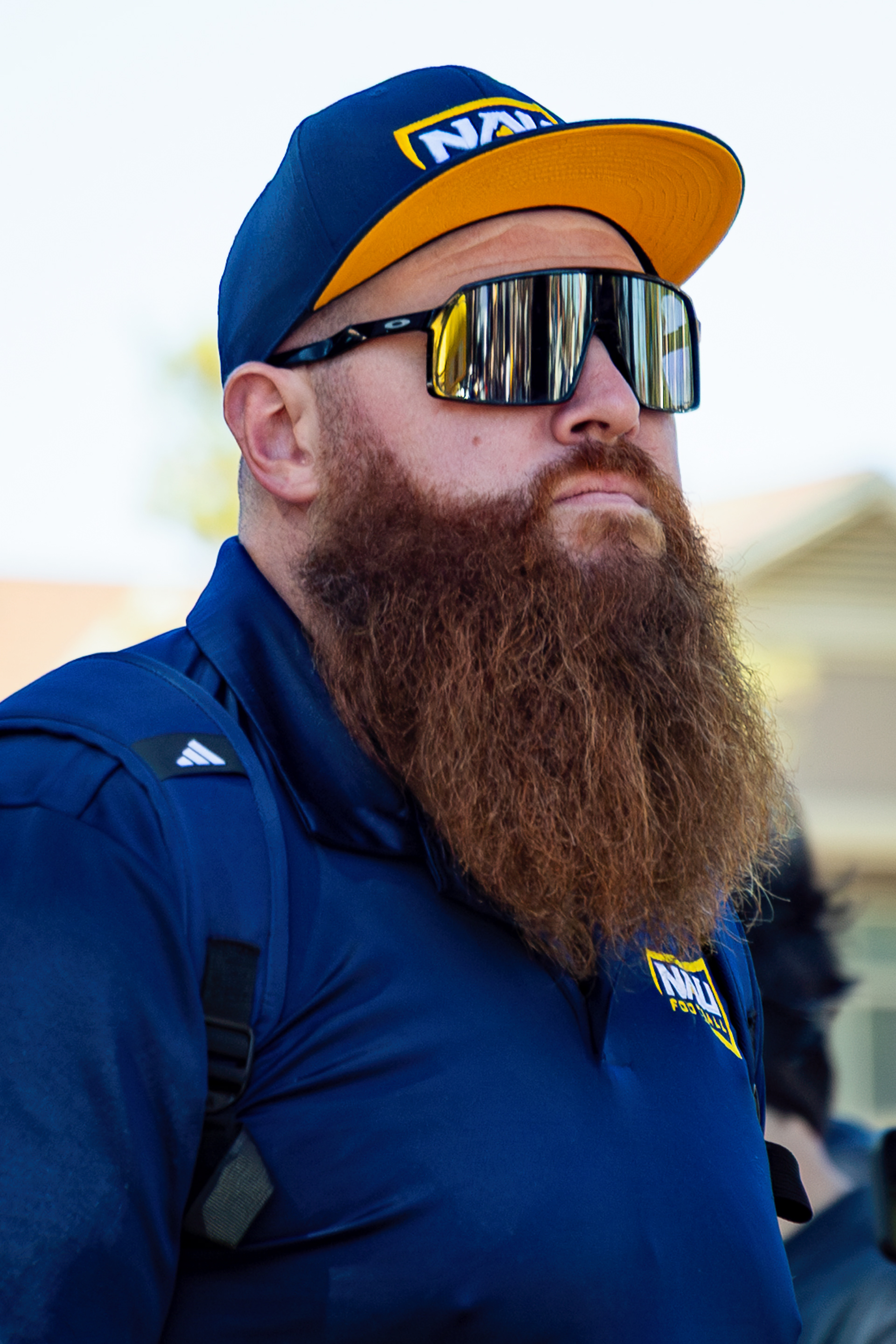 NAU Football Strength and Conditioning  coach Matt Sommers walks through The Lumberjack Walk before the Big Sky Conference football game against Montana State, Oct. 4. 