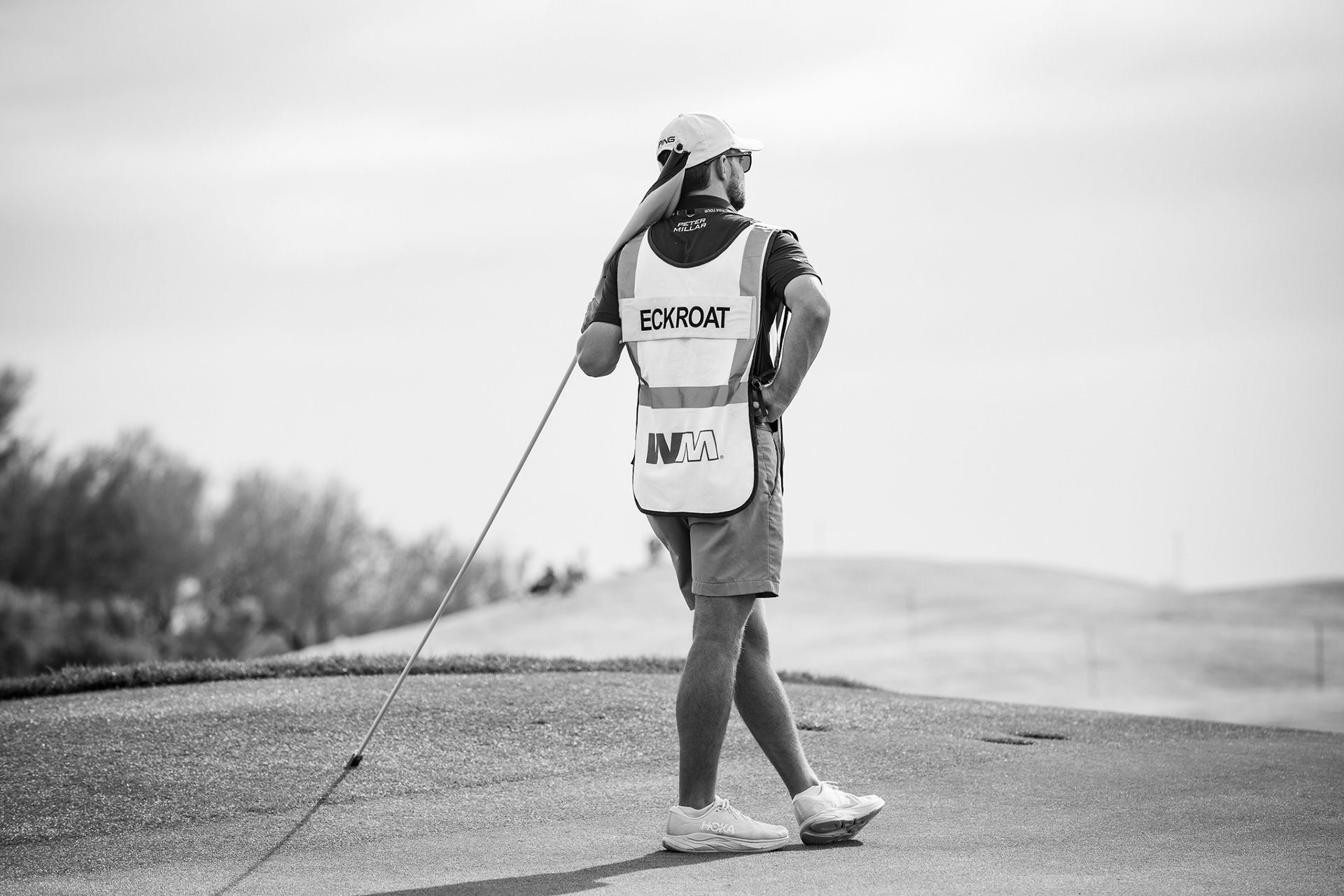 Stone Coburn, caddie of Austin Eckroat, looks out into the distance on the par 3 fourth hole during the first round of the WM Phoenix Open at TPC Scottsdale. I really liked the natural composition of him looking out into the distance like this. It was a beautiful simplistic moment that naturally happened. Taken on the EF 70-200 f/2.8 February 5th, 2026.