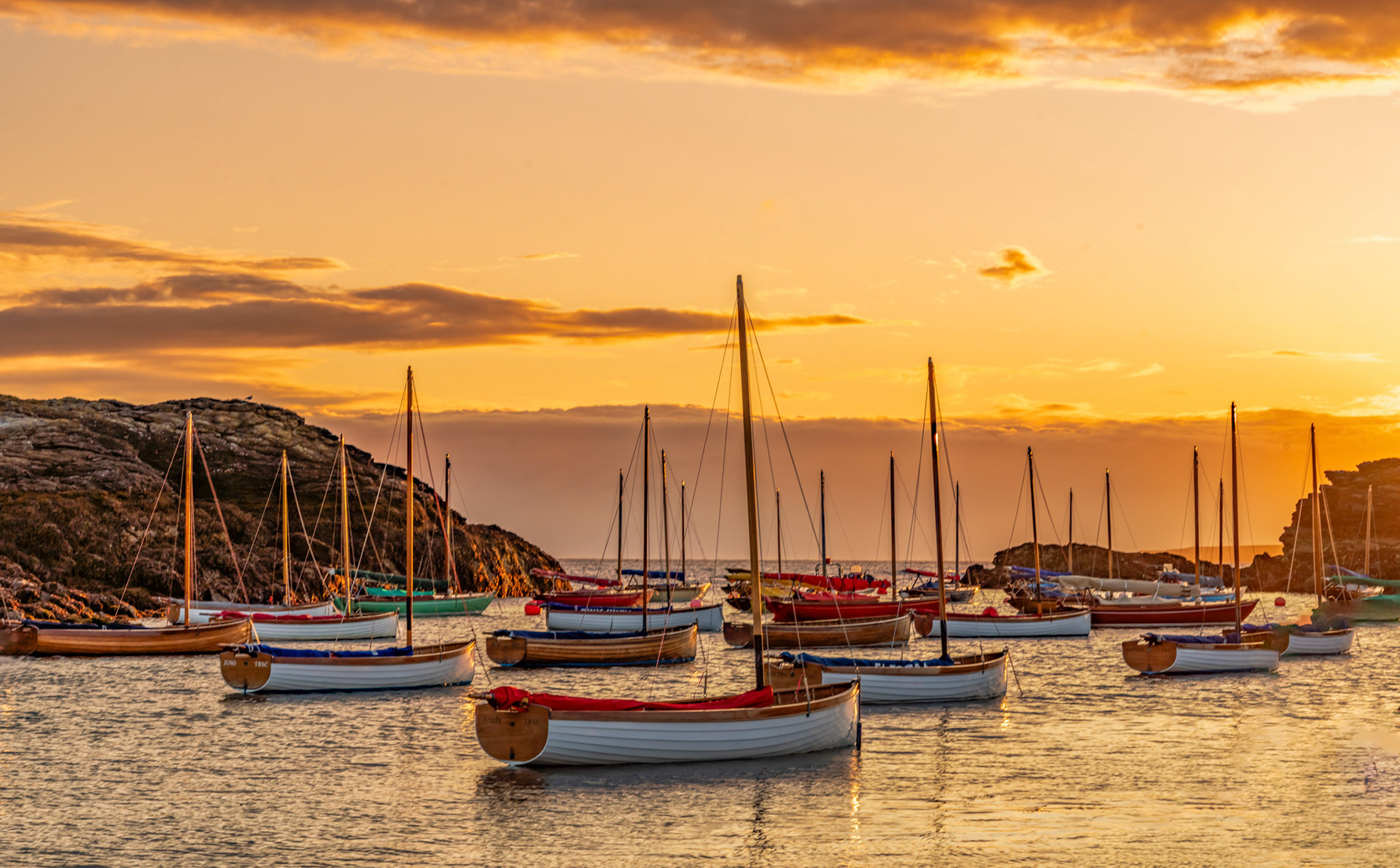Boats in the sunset at Porth Diana Treardddur Bay