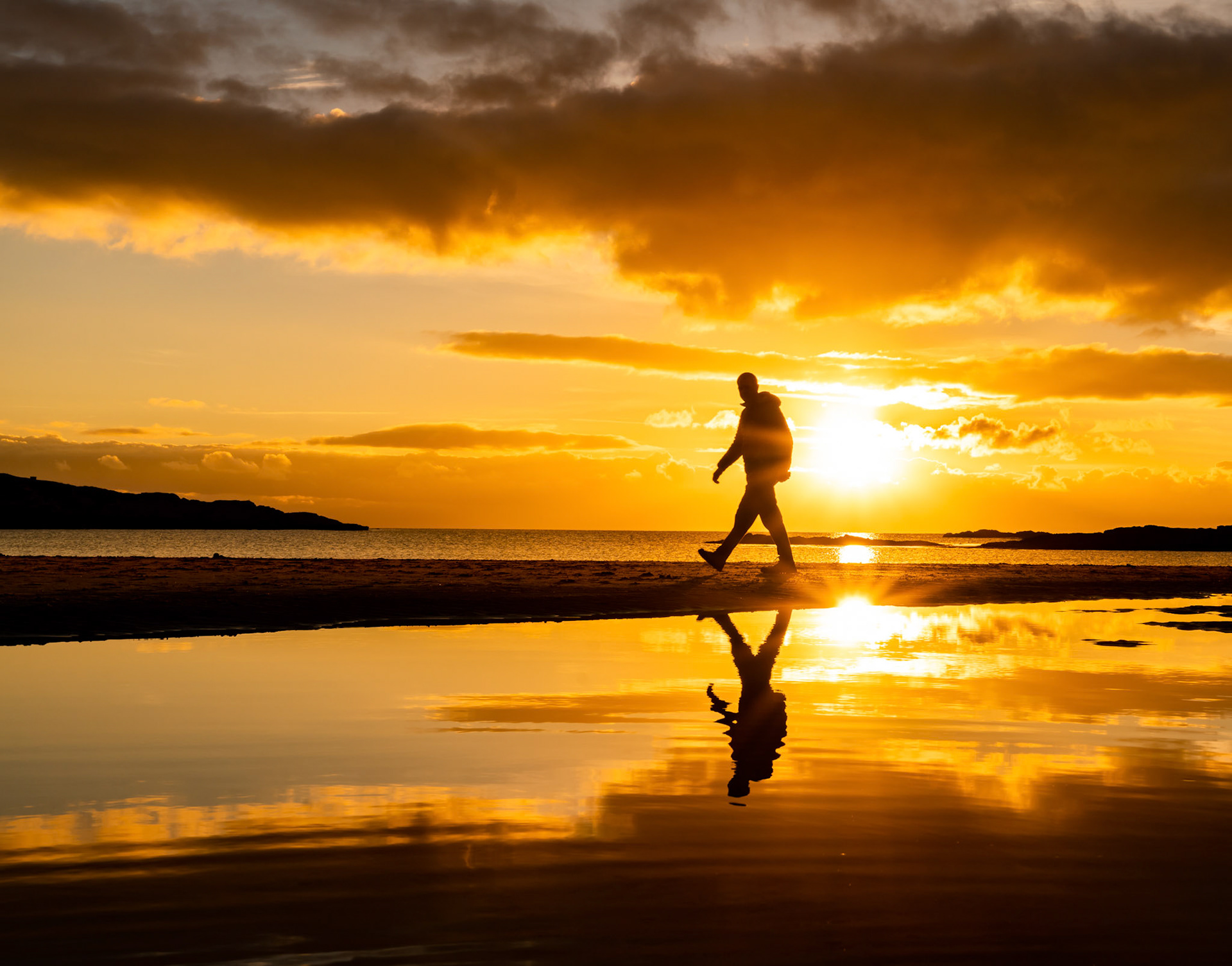 Sunrise on a tidal island with a church on it