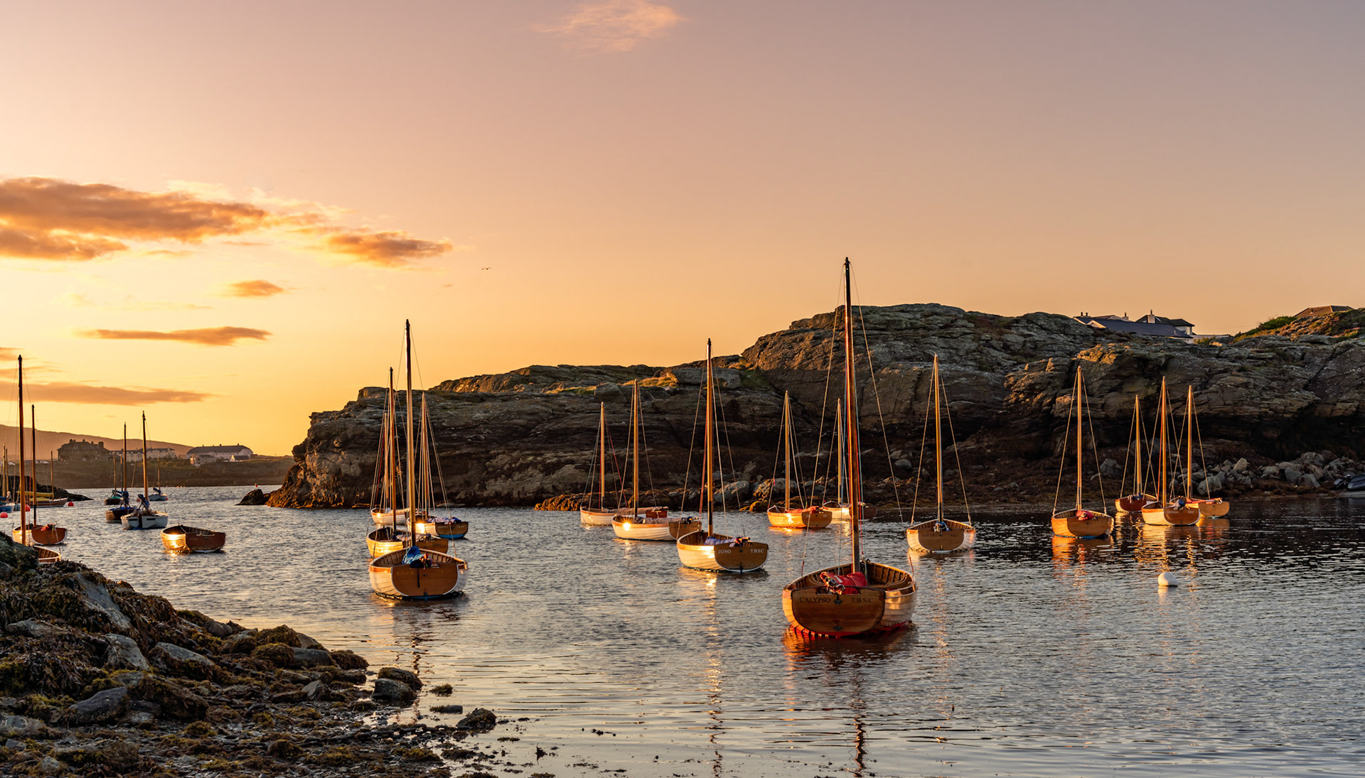 Boats in the sunset at Porth Diana Treardddur Bay