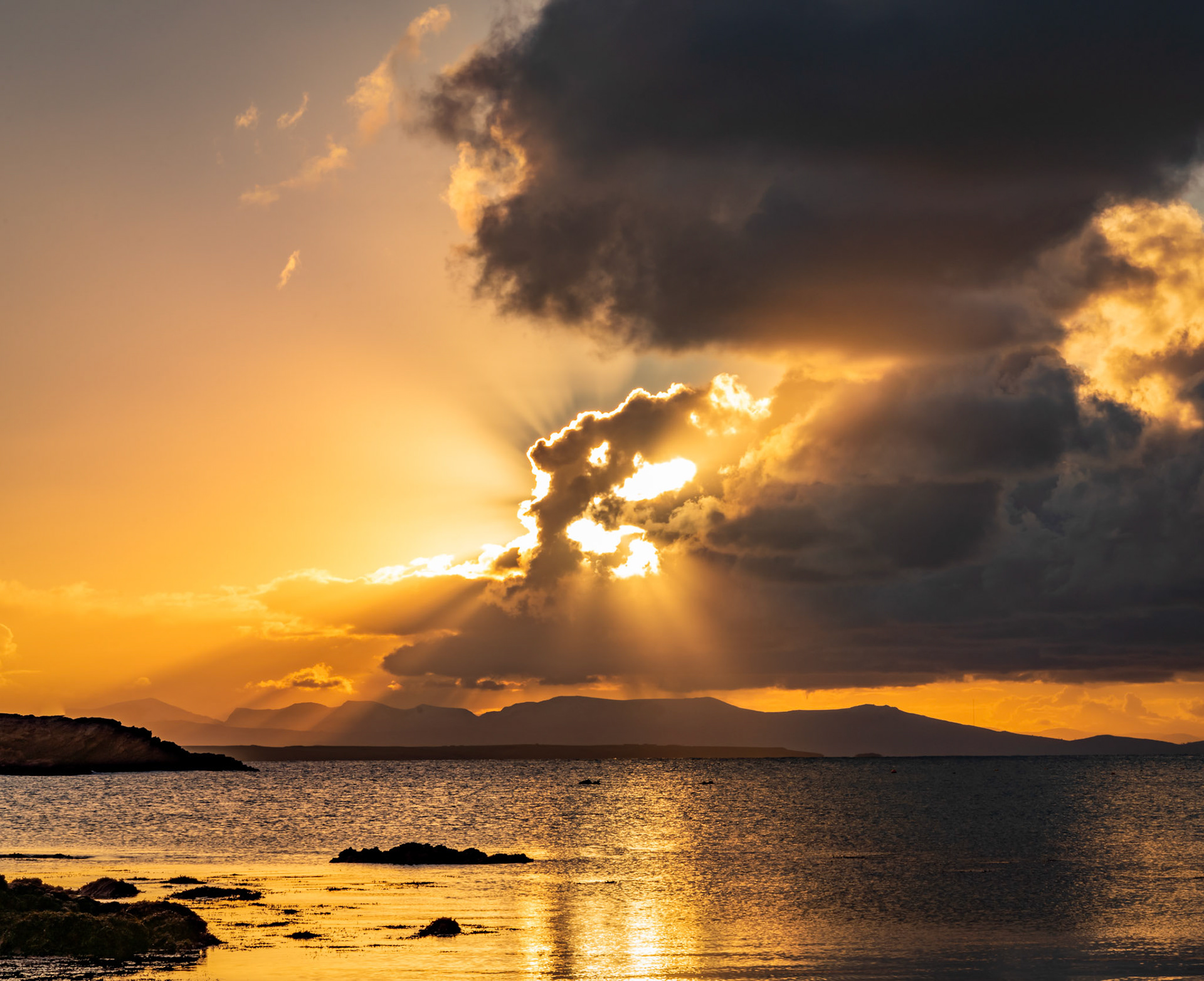 Sunrise from rhoscolyn Beach looking to Snowdonia