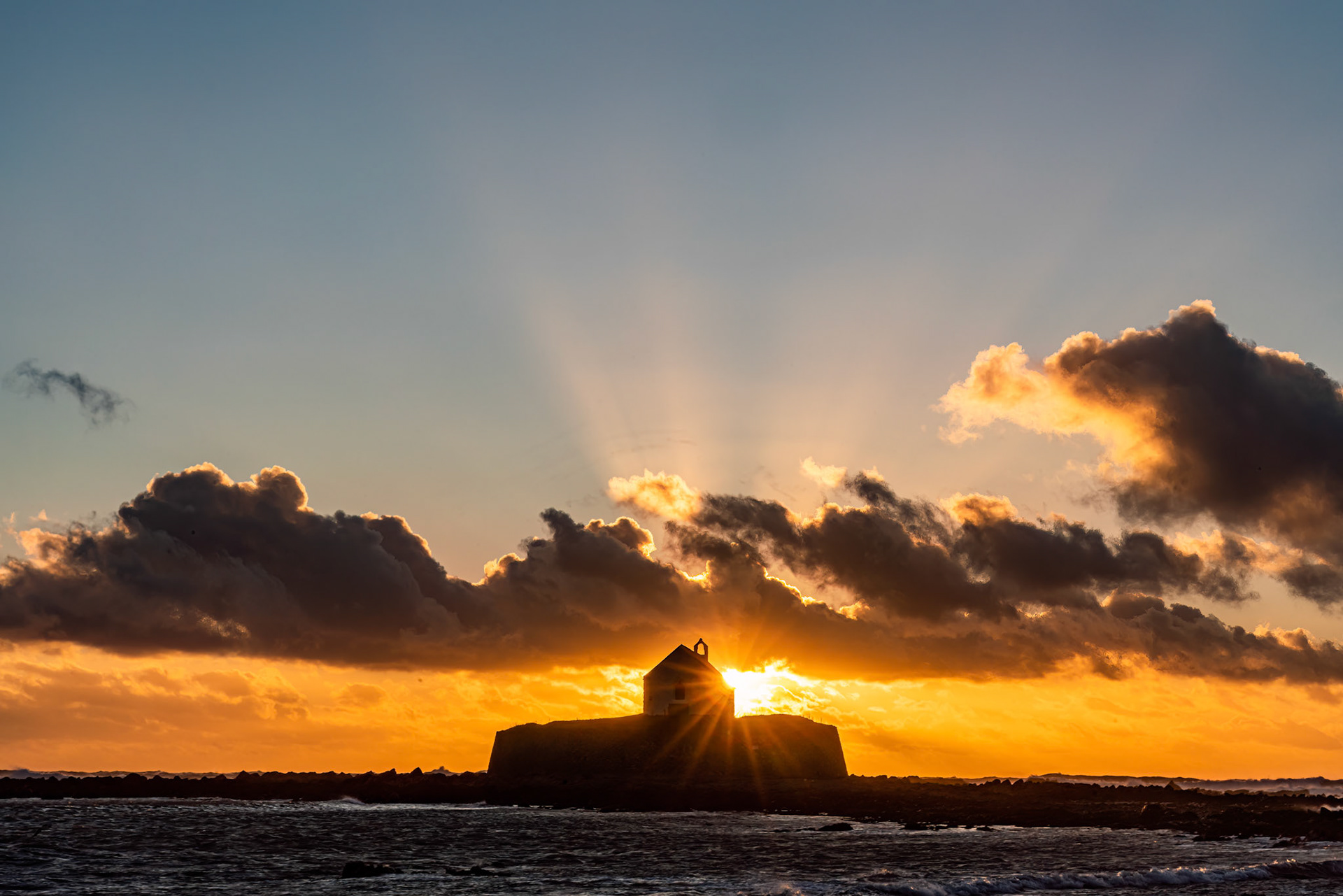 Sunset overlooking the church on an island -Isle of Anglesey Wales