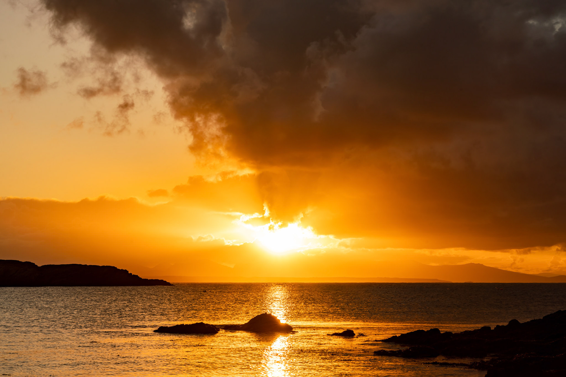 Sunrise from rhoscolyn Beach looking to Snowdonia