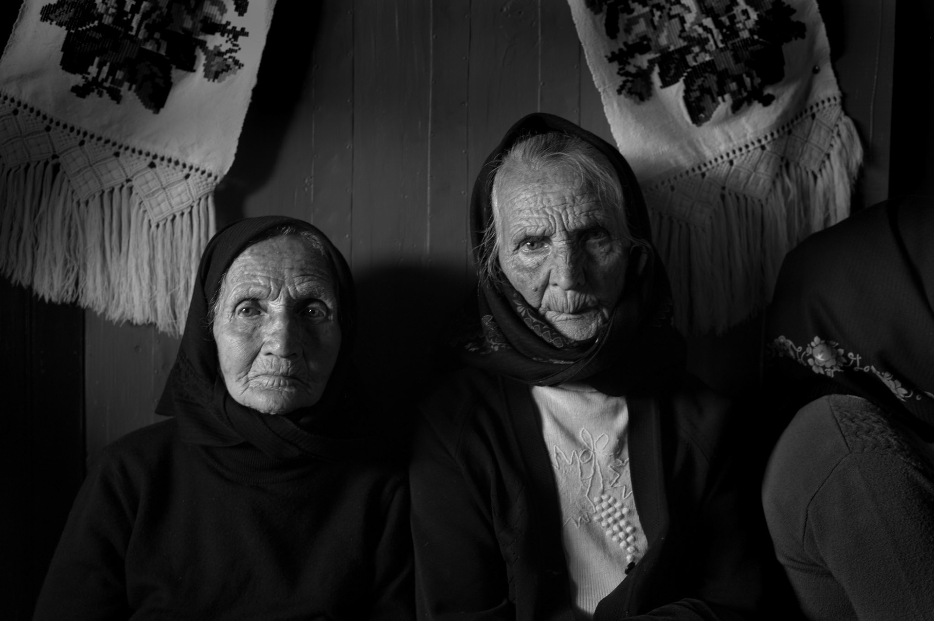 Two old Romanian ladies attending an orthodox church service.