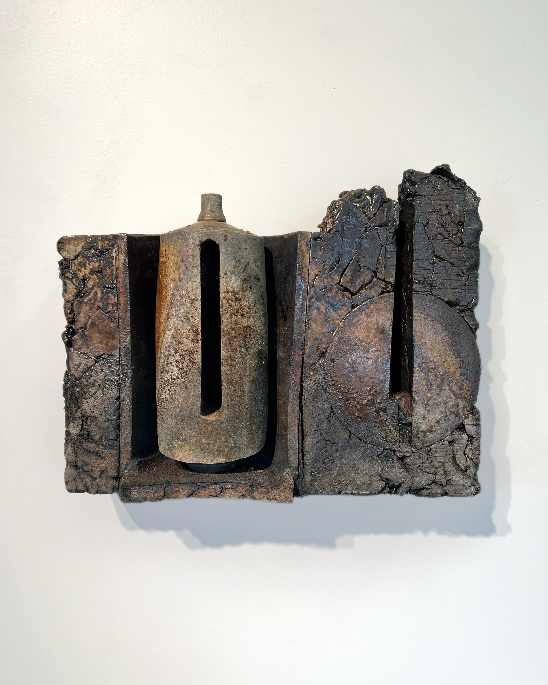 Wall Bottle Assemblage 1, 17” L X 12.5” H X 5” W, 2026, Stoneware