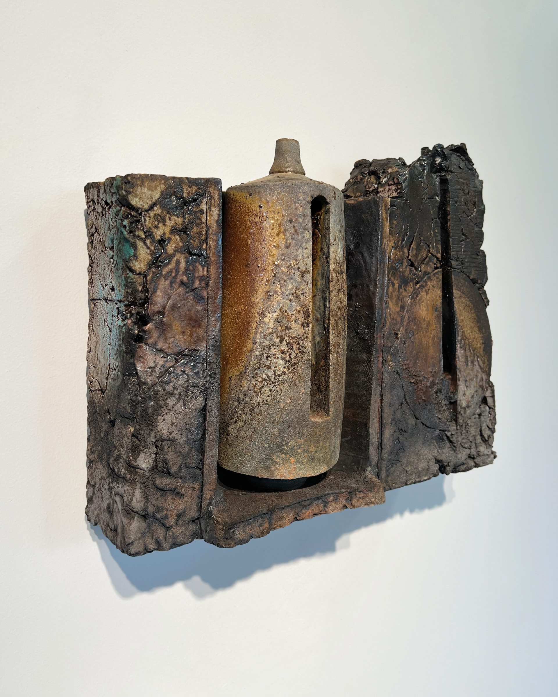 Wall Bottle Assemblage 1, 17” L X 12.5” H X 5” W, 2026, Stoneware